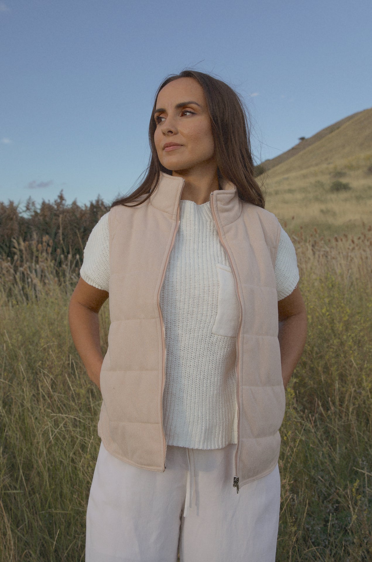 taupe padded zip up vest with a mini chevron print