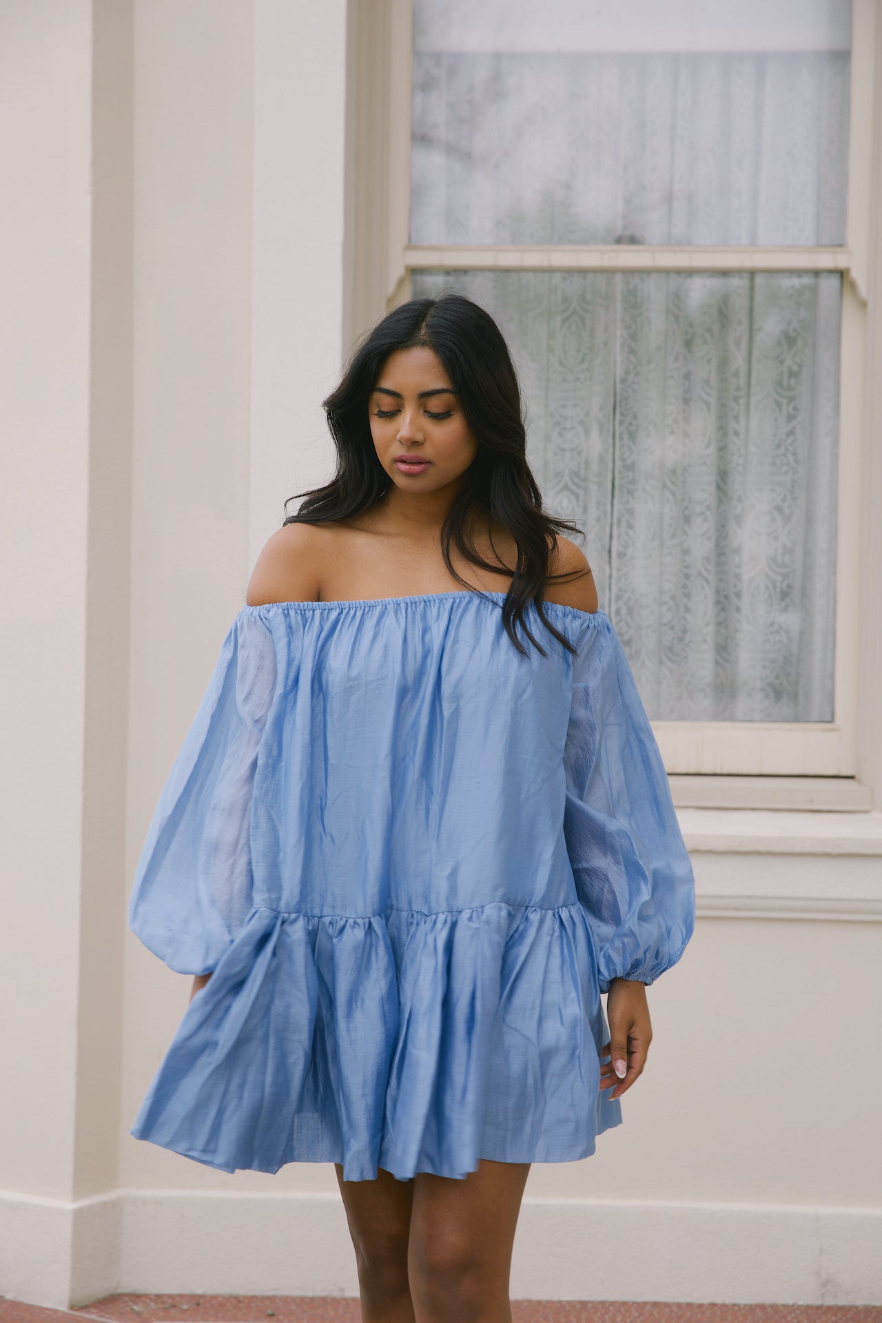 blue off the shoulder loose mini dress with puffy long sleeves and tiered skirt