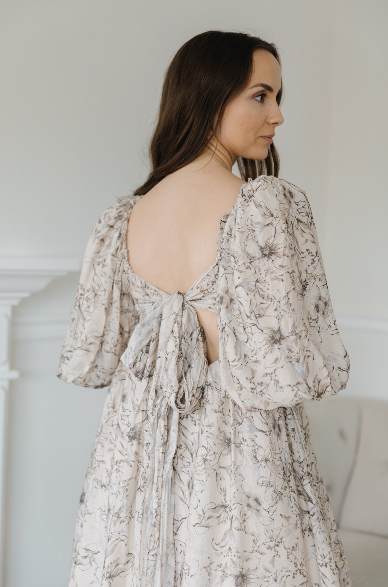 beige floral puff sleeve midi dress with a back bow tie