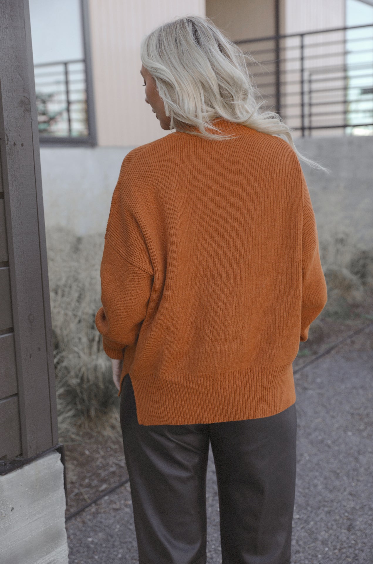 burnt orange camel knit sweater with an oversized fit