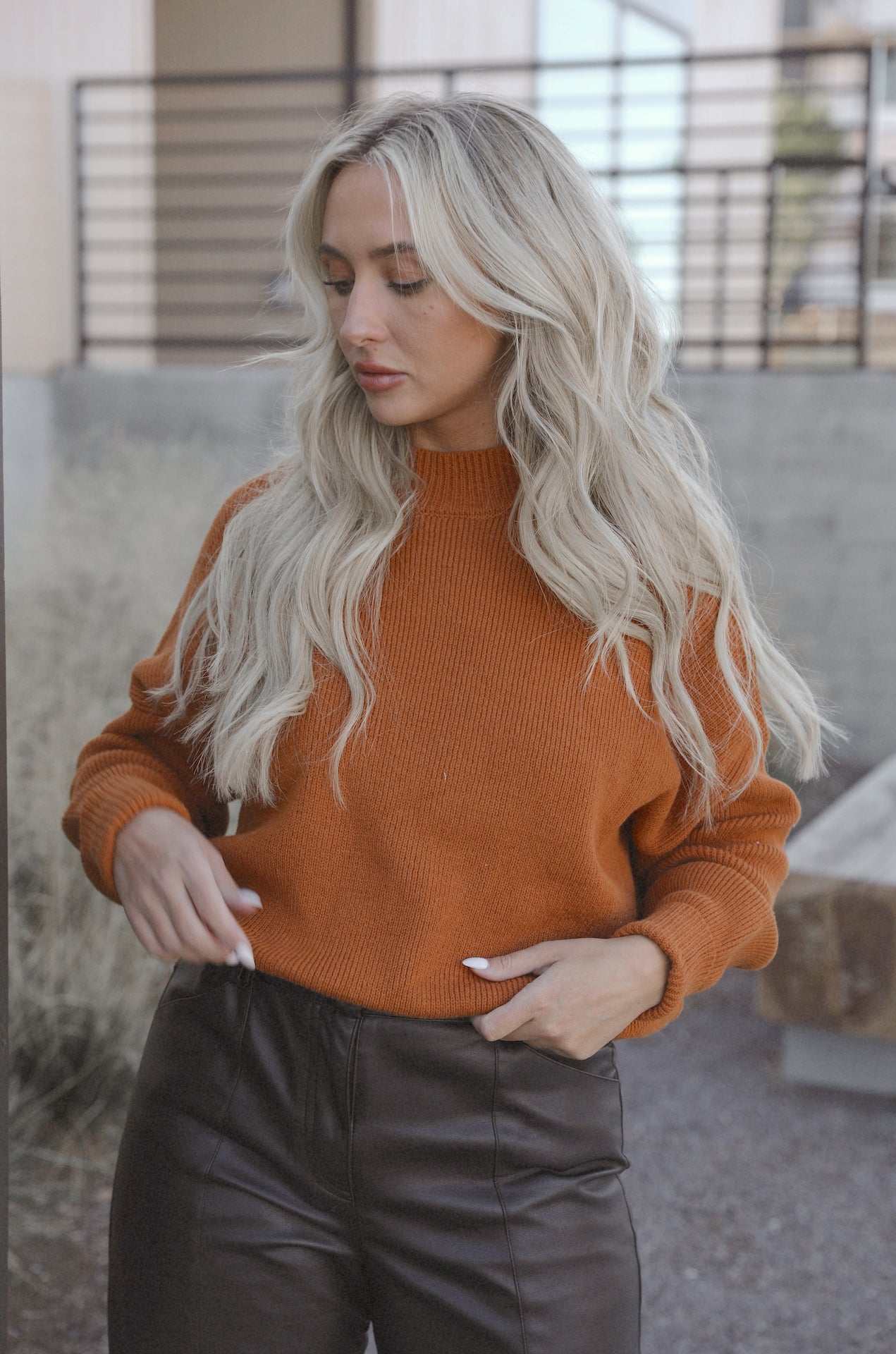 burnt orange camel knit sweater with an oversized fit
