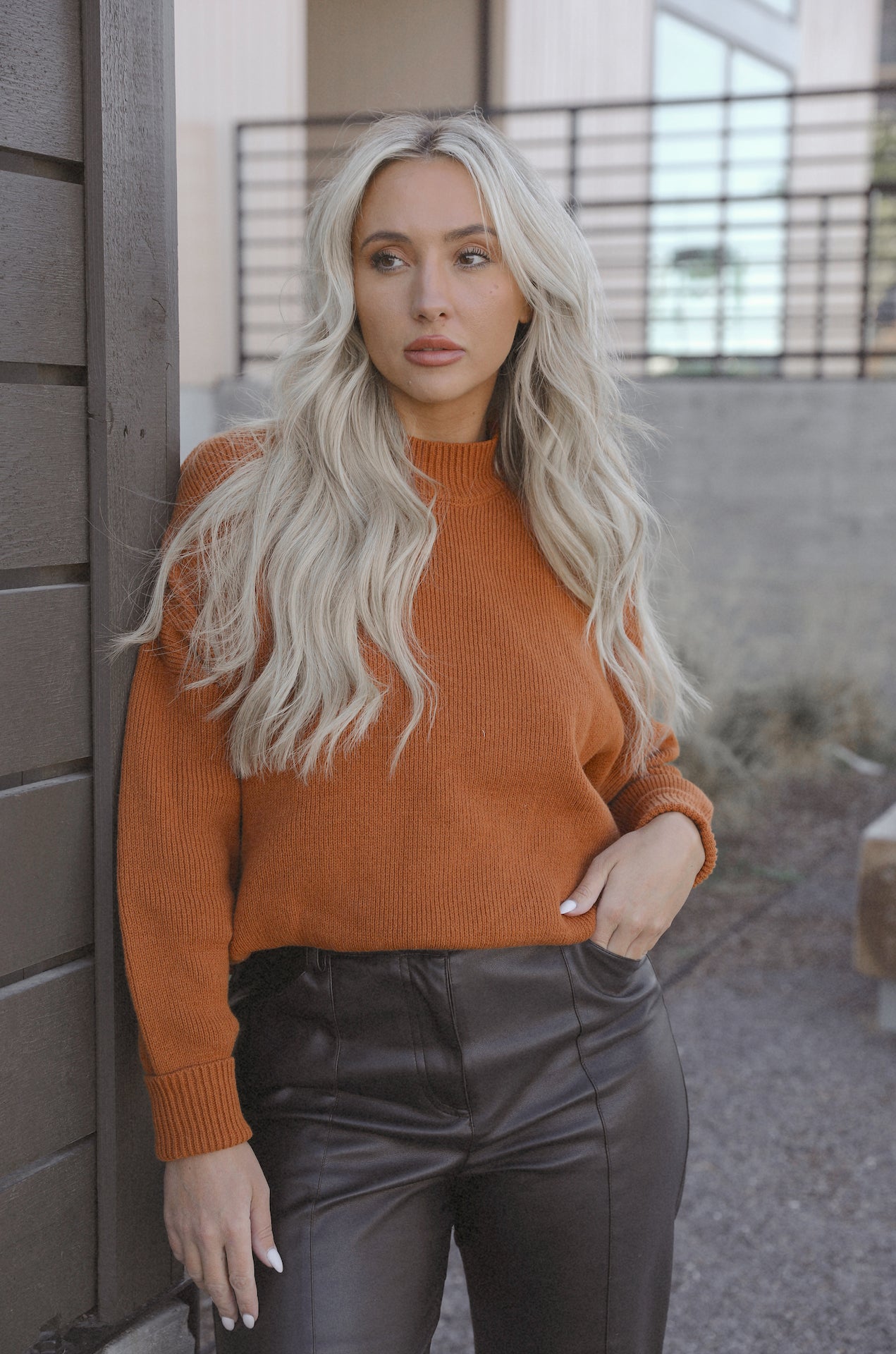 burnt orange camel knit sweater with an oversized fit