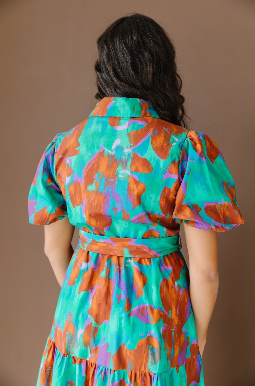 Green and brown puff sleeve button down cotton shirt dress with maxi length, waist tie and side pockets.