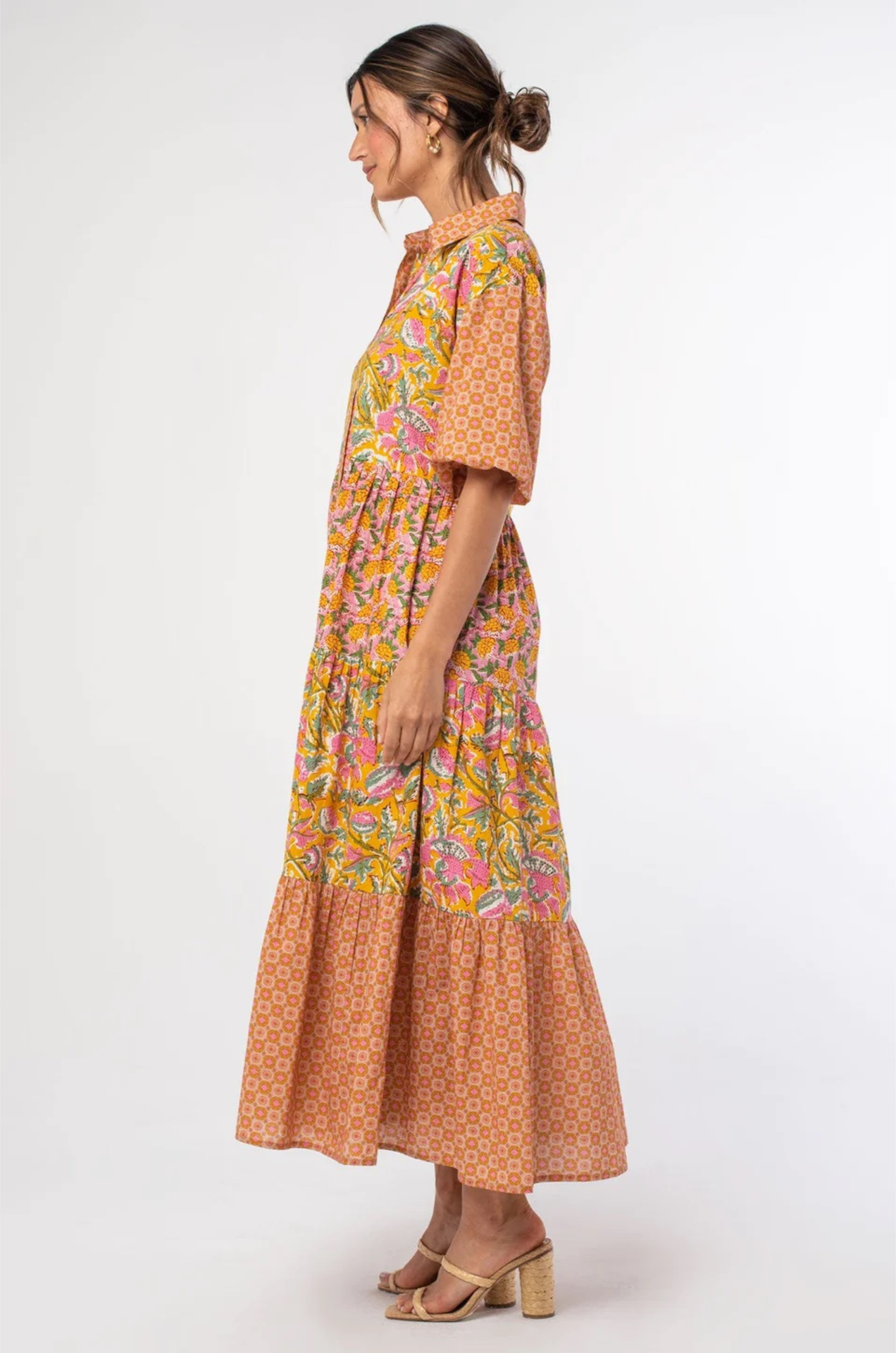 vibrant tiered maxi dress with puff sleeves and an orange and pink pattern