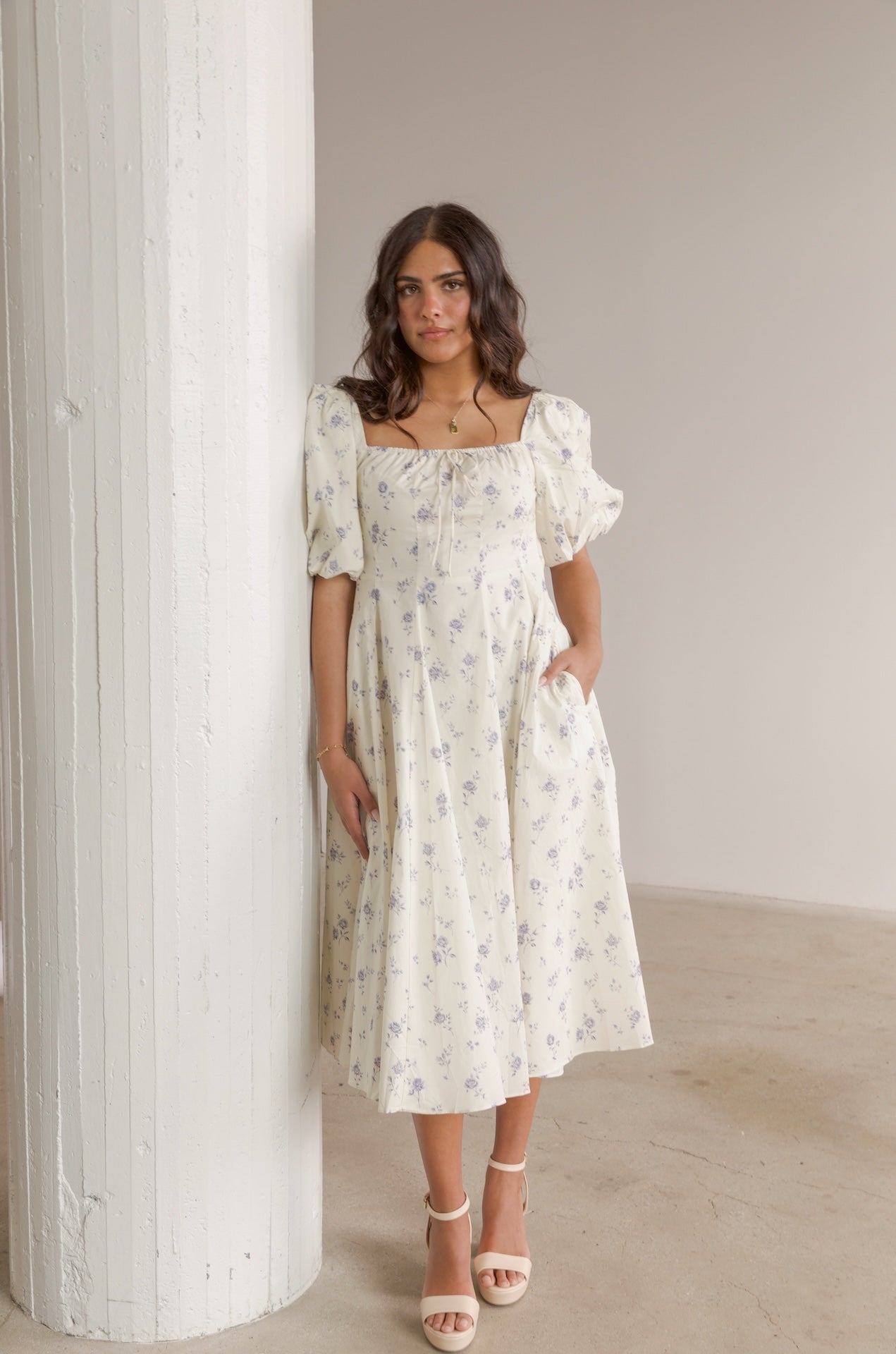 cream and blue floral midi dress with puff sleeves and square neckline