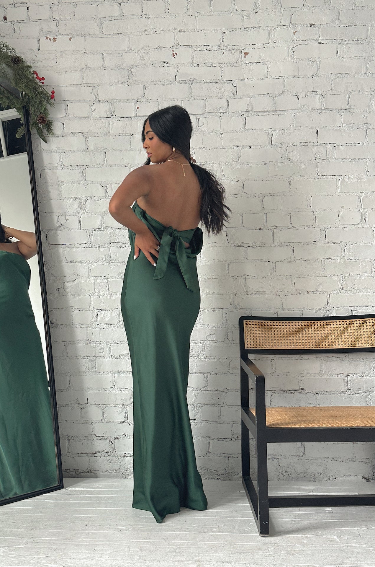 emerald green cowl back strapless maxi dress with a back bow tie