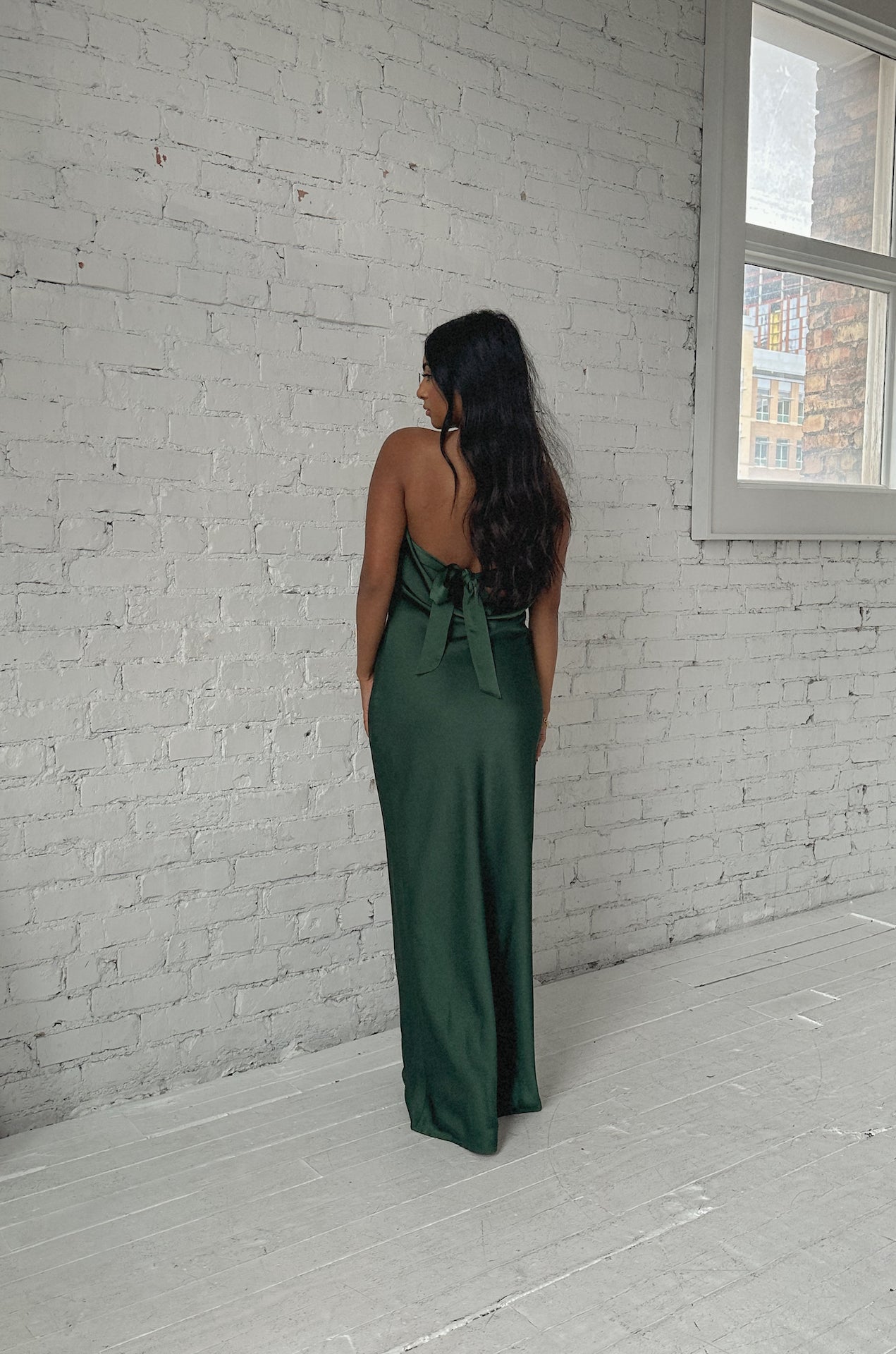 emerald green cowl back strapless maxi dress with a back bow tie