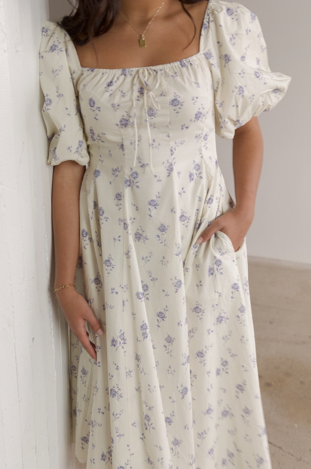cream and blue floral midi dress with puff sleeves and square neckline