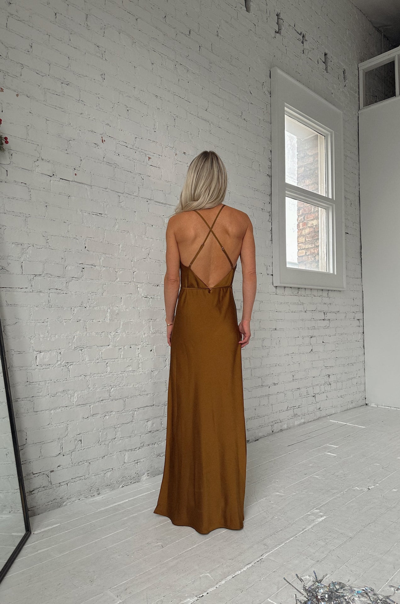 sleeveless bronze brown satin maxi dress with a cowl neckline and criss cross back