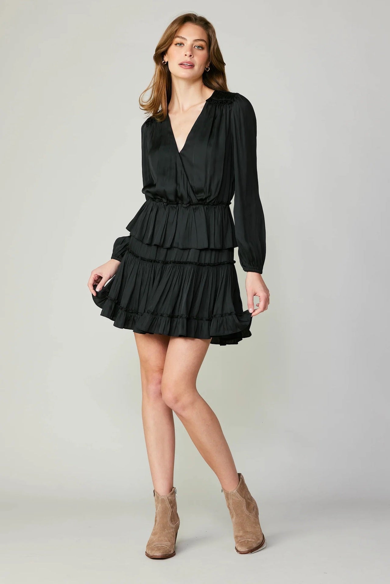 black tiered mini dress with long sleeves and pleated detail
