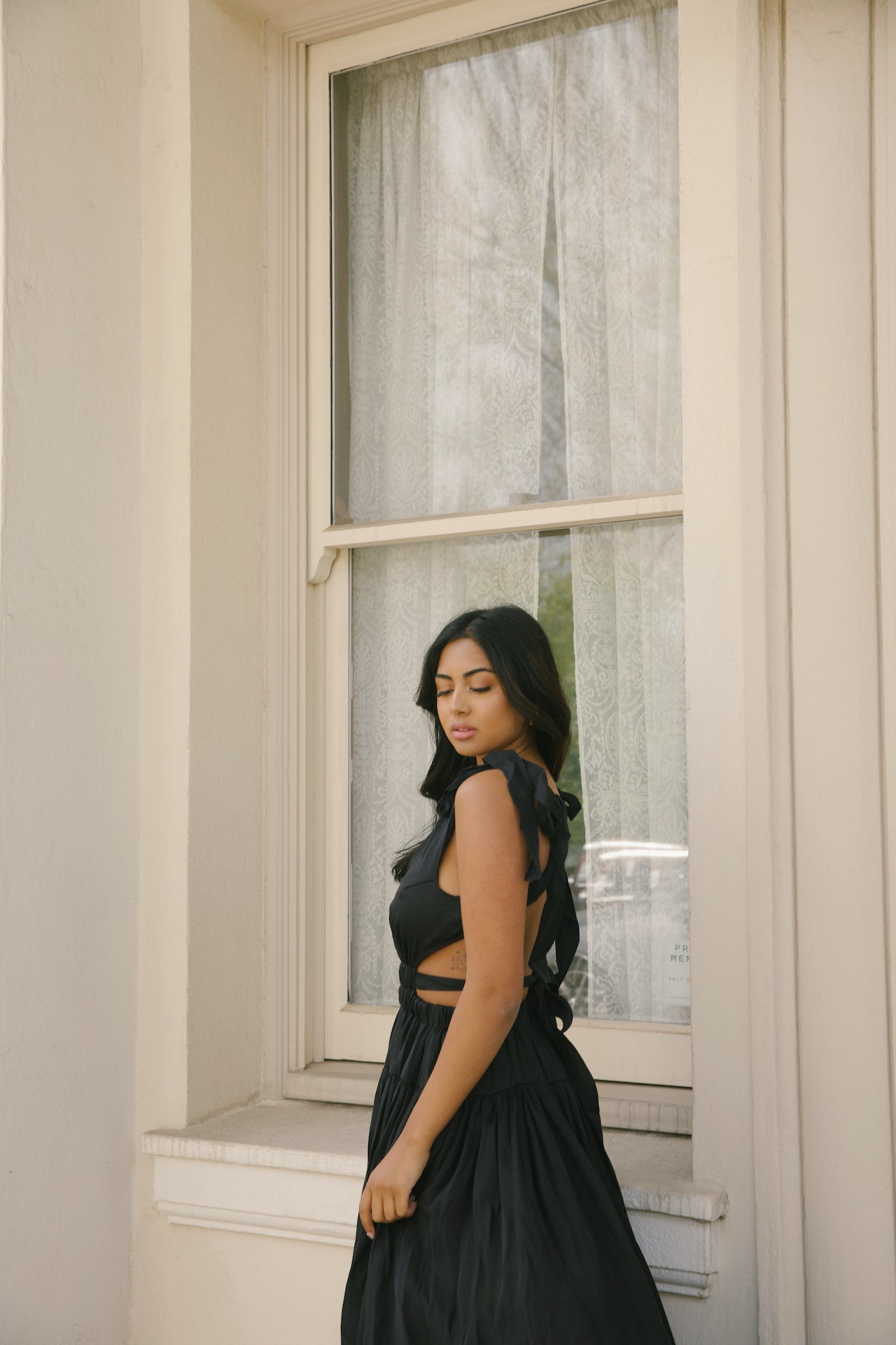 black cut out maxi dress with an open back