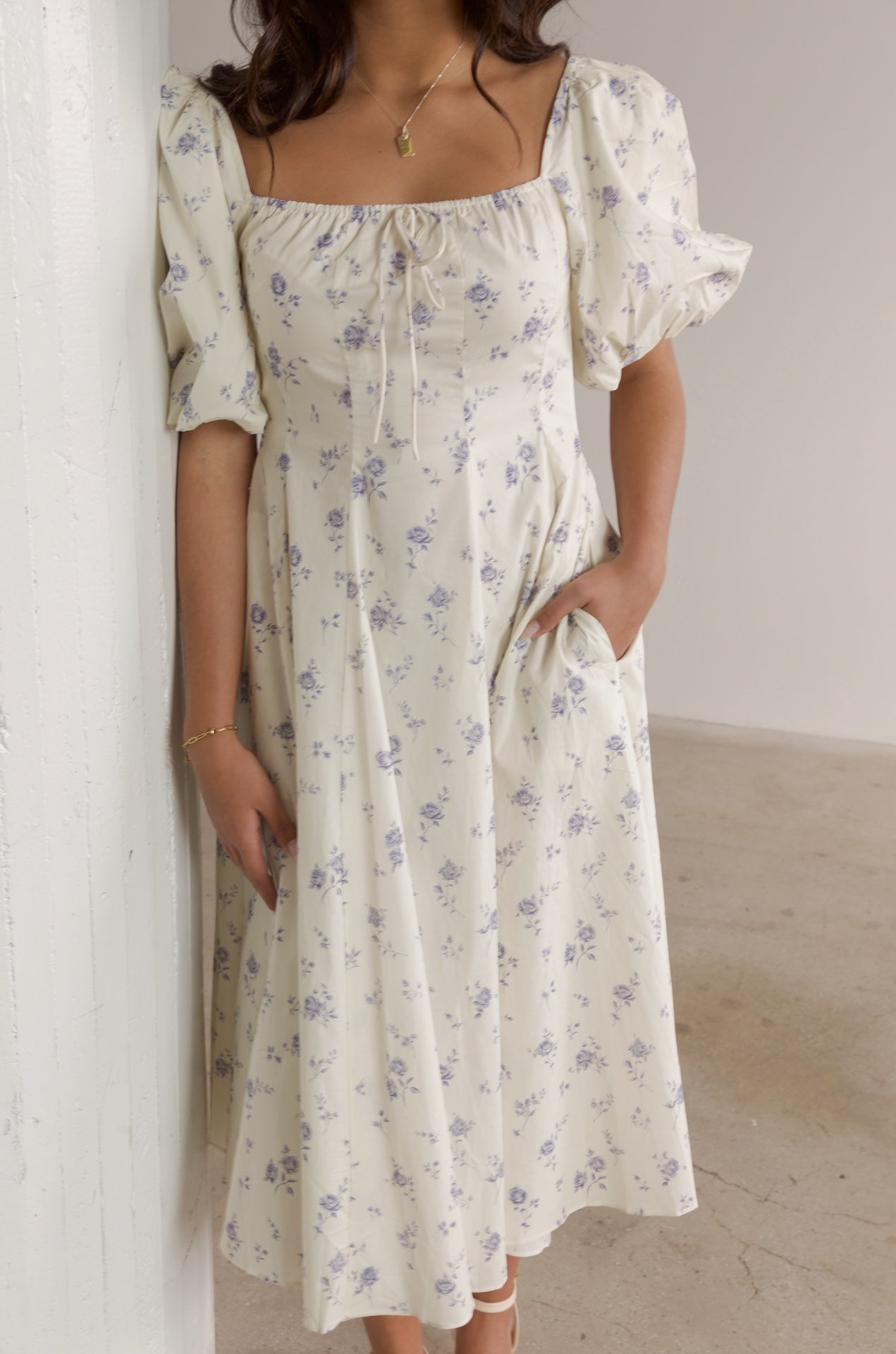 cream and blue floral midi dress with puff sleeves and square neckline