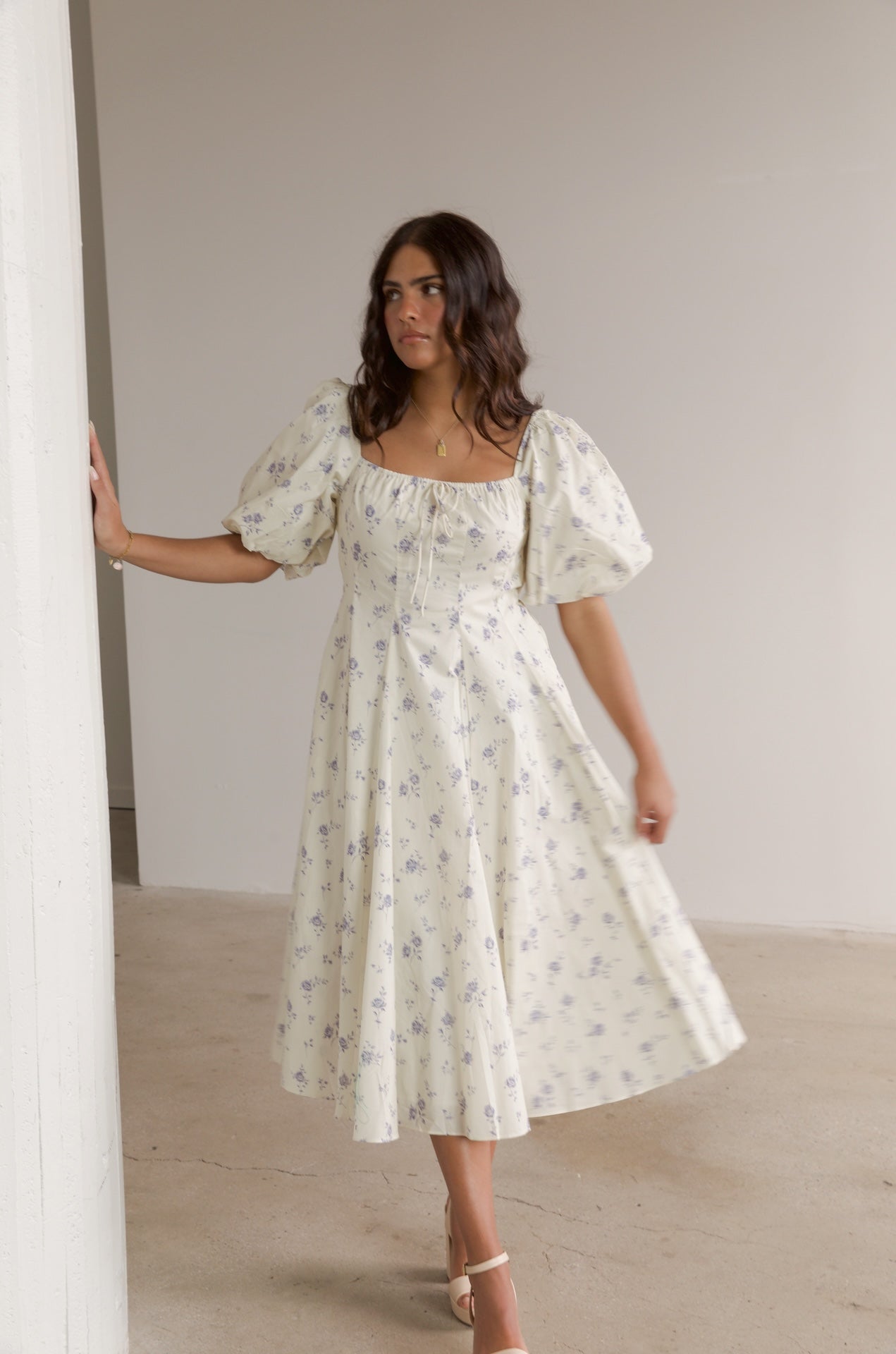 cream and blue floral midi dress with puff sleeves and square neckline