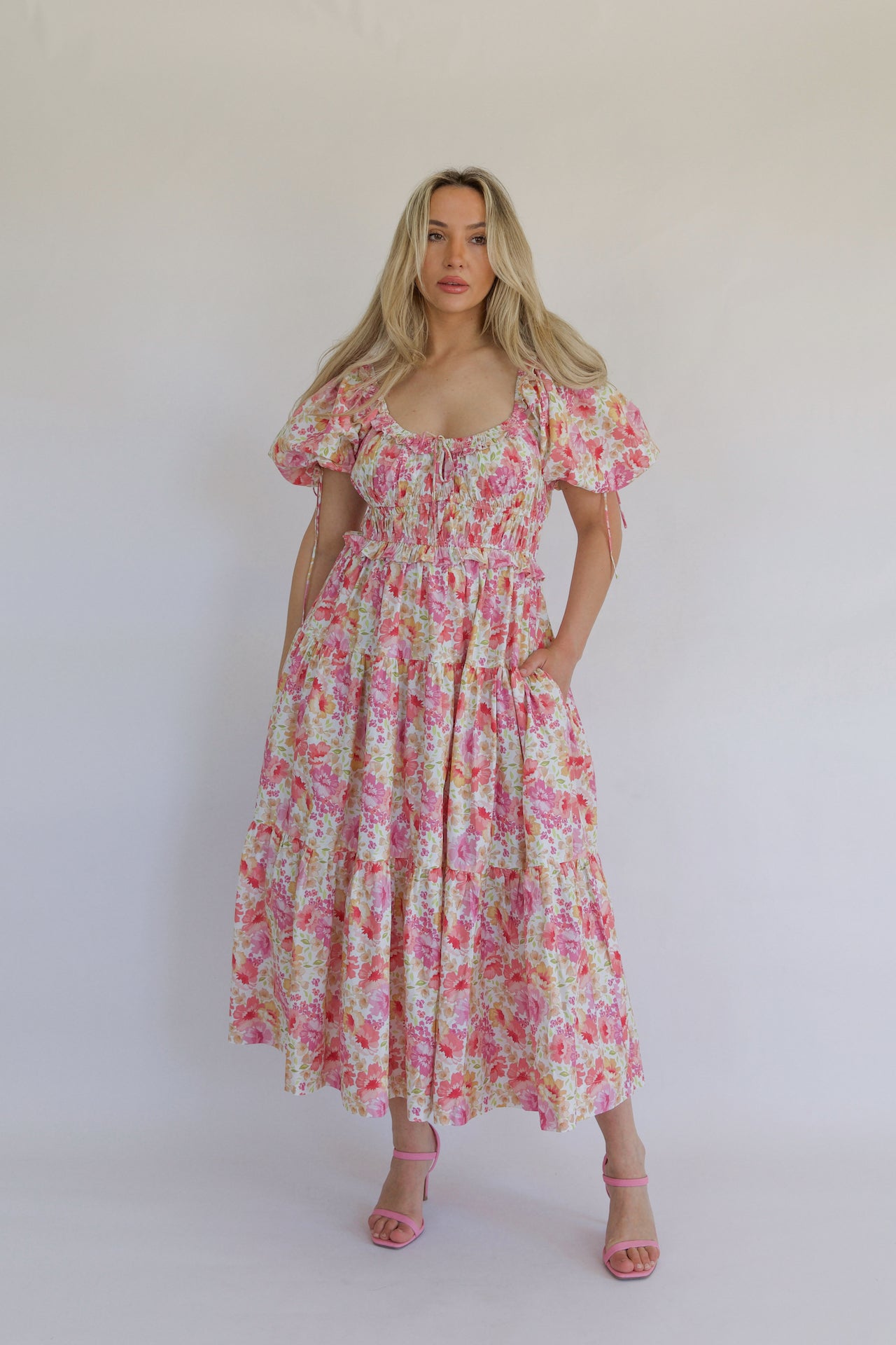 pink floral tiered maxi dress with pockets and puff sleeves