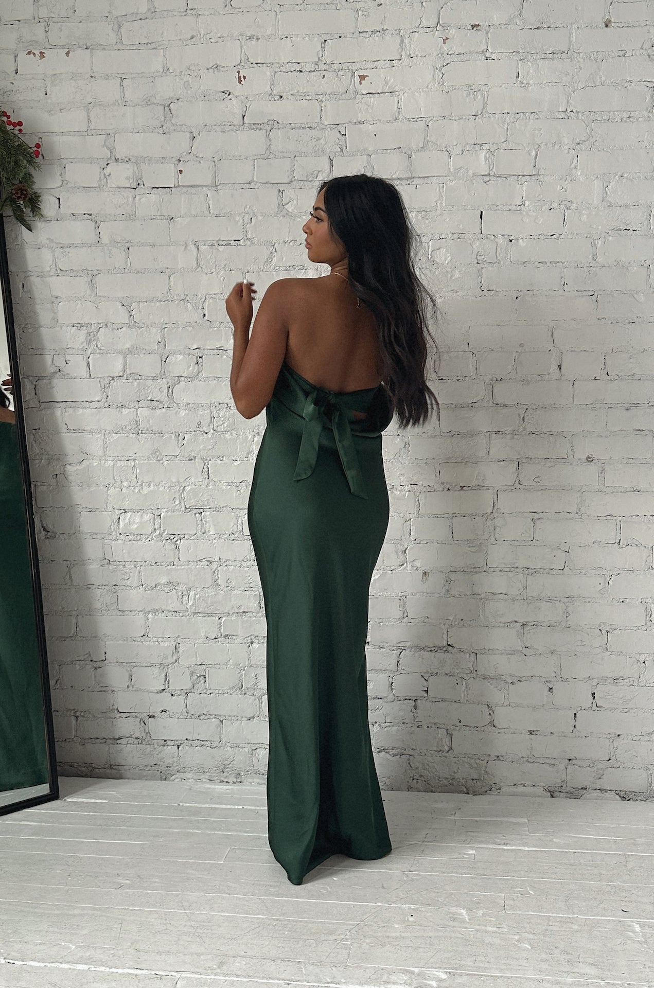 emerald green cowl back strapless maxi dress with a back bow tie