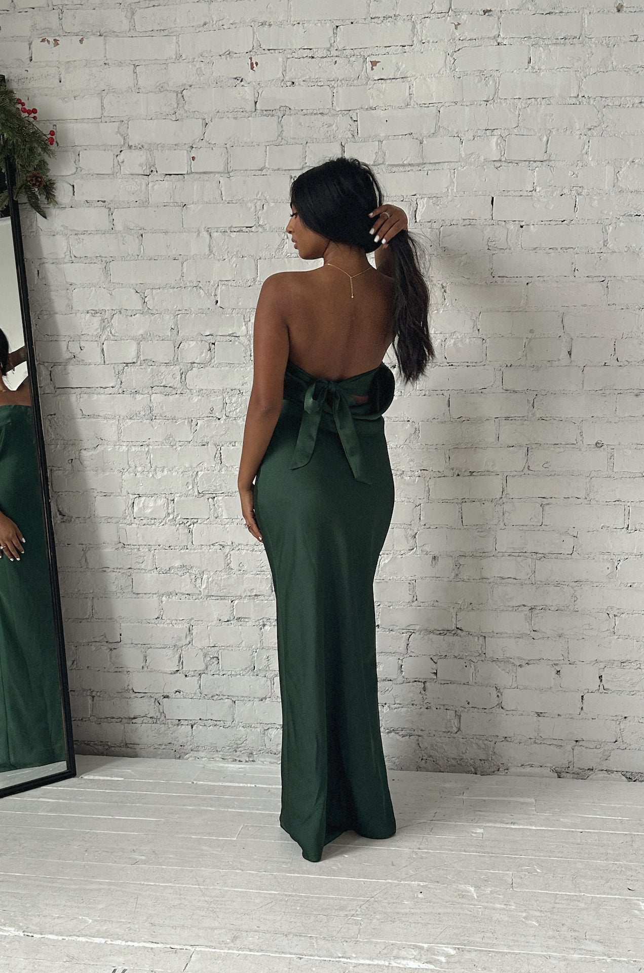 emerald green cowl back strapless maxi dress with a back bow tie