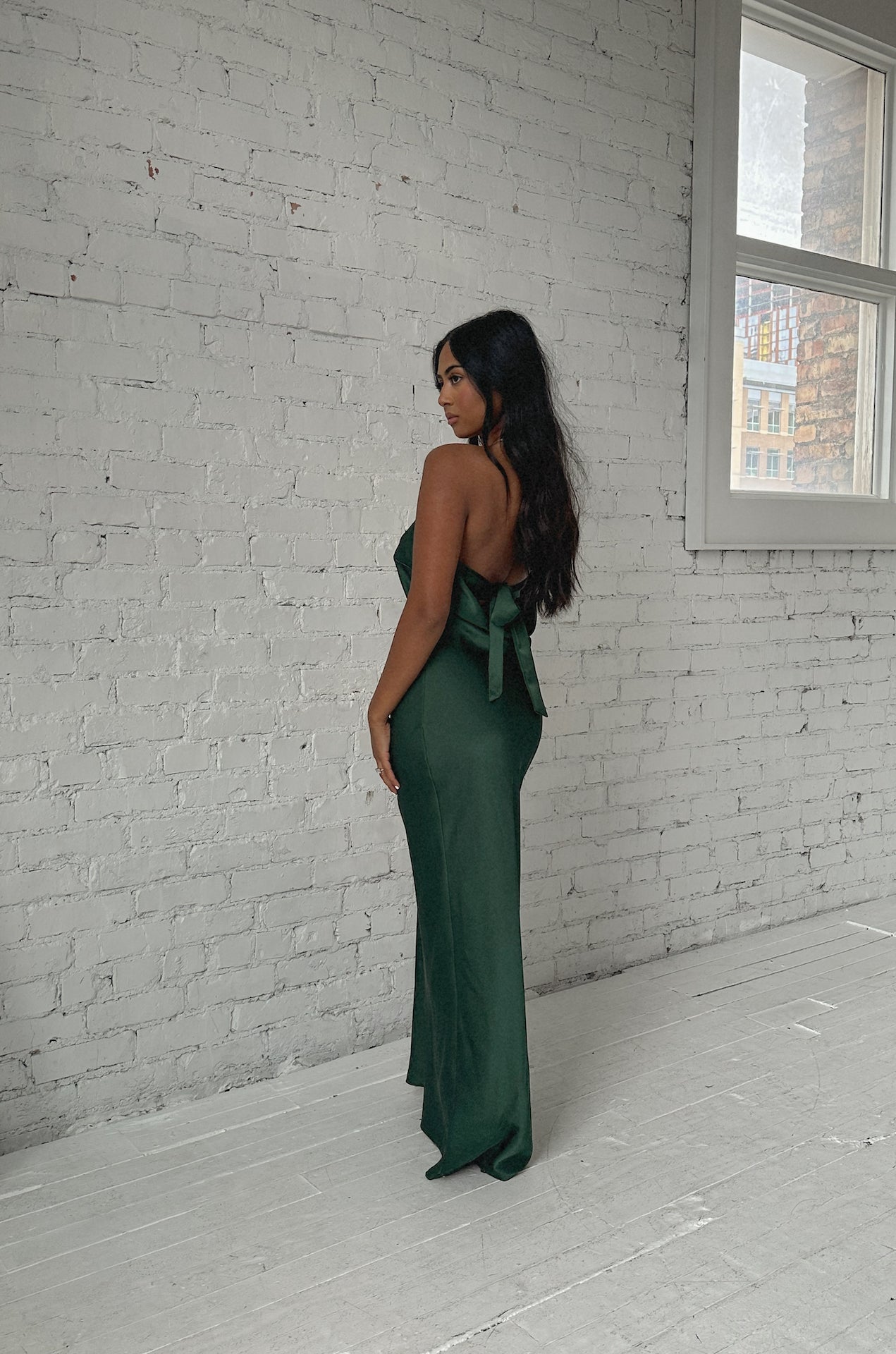 emerald green cowl back strapless maxi dress with a back bow tie