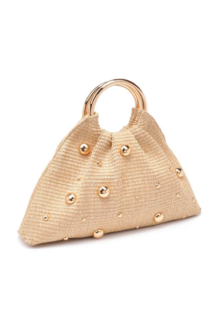 natural straw woven bag with gold studded detail and round gold top handle