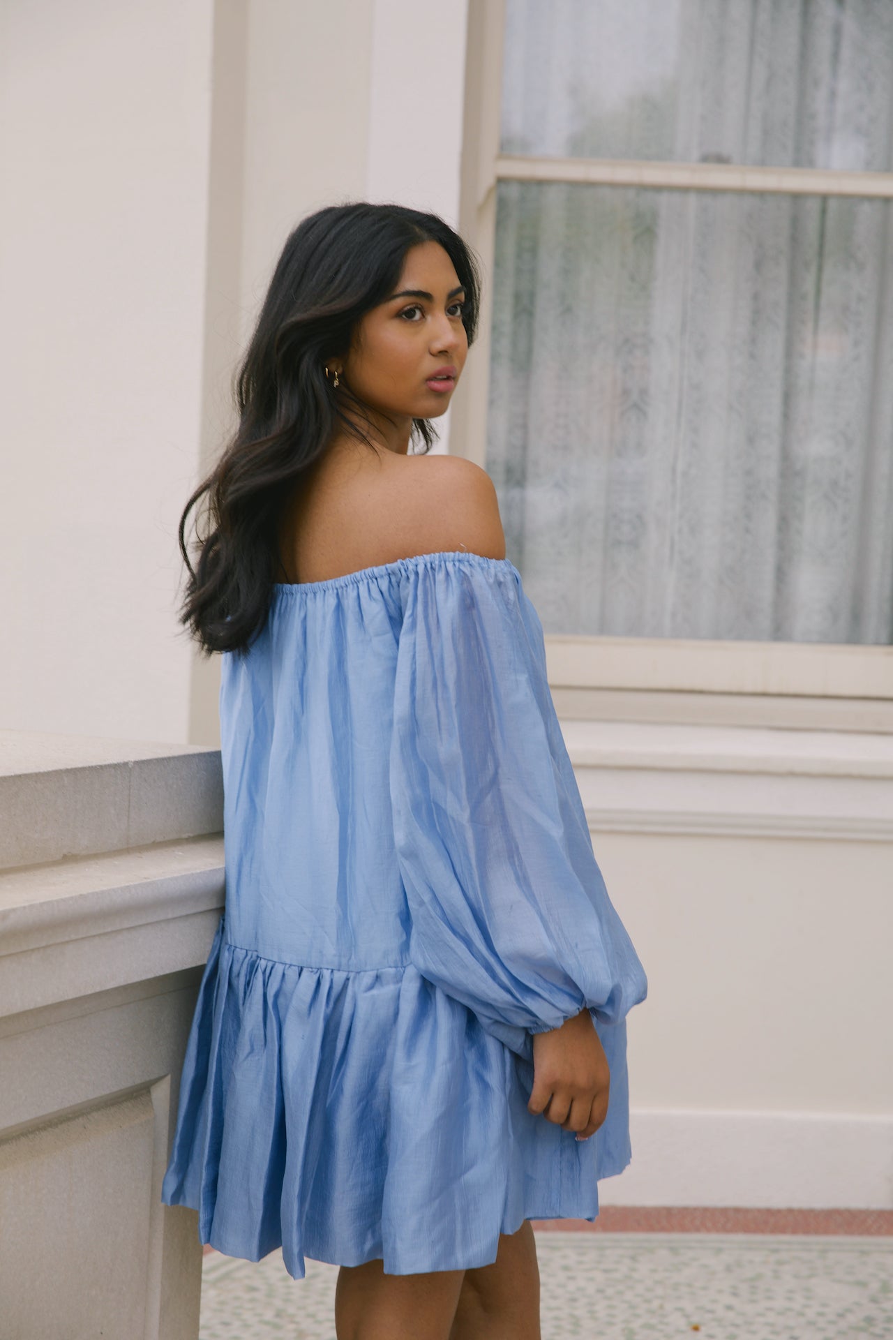 blue off the shoulder loose mini dress with puffy long sleeves and tiered skirt