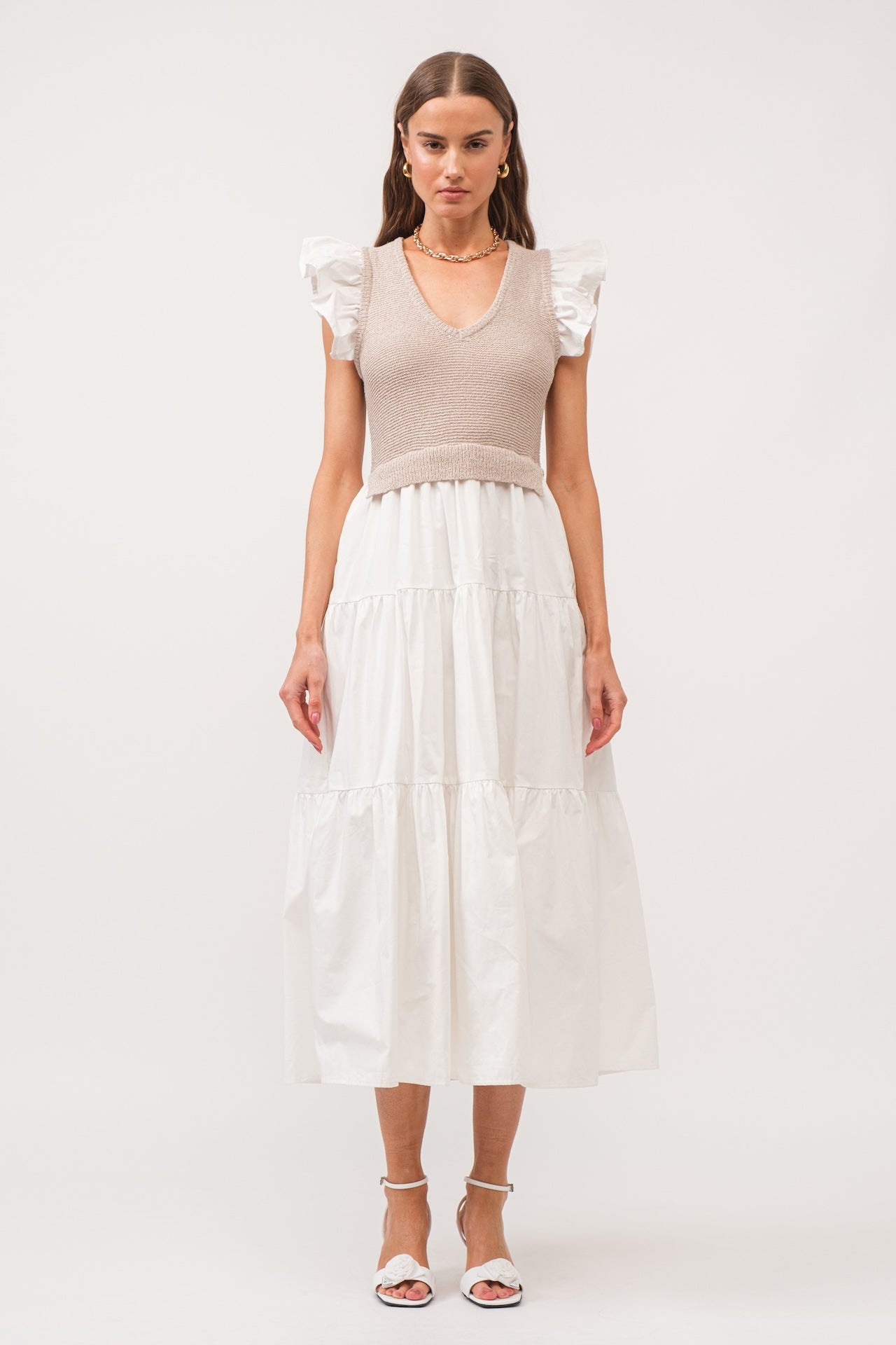 white flutter sleeve tiered midi dress with beige built in knit vest