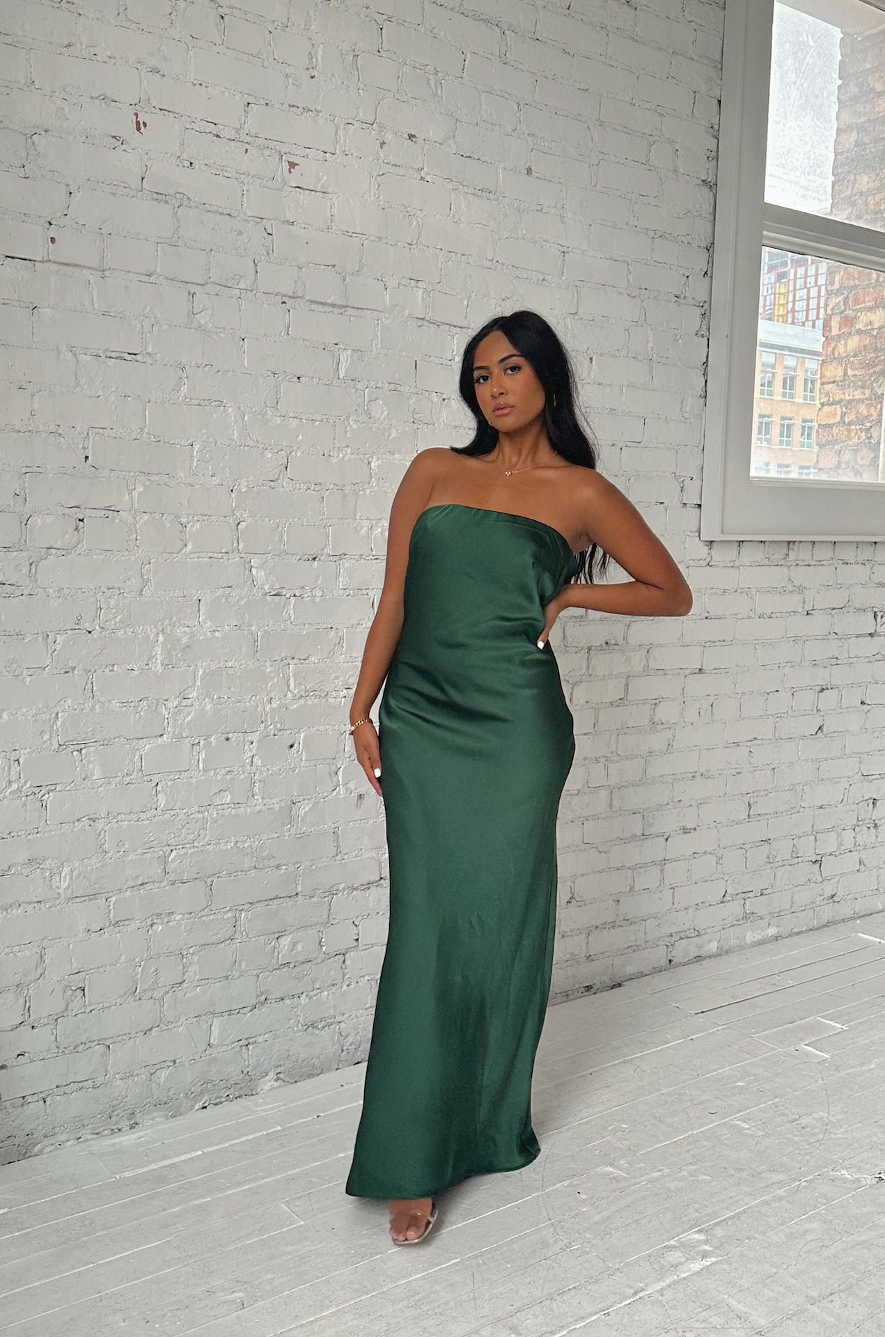 emerald green cowl back strapless maxi dress with a back bow tie