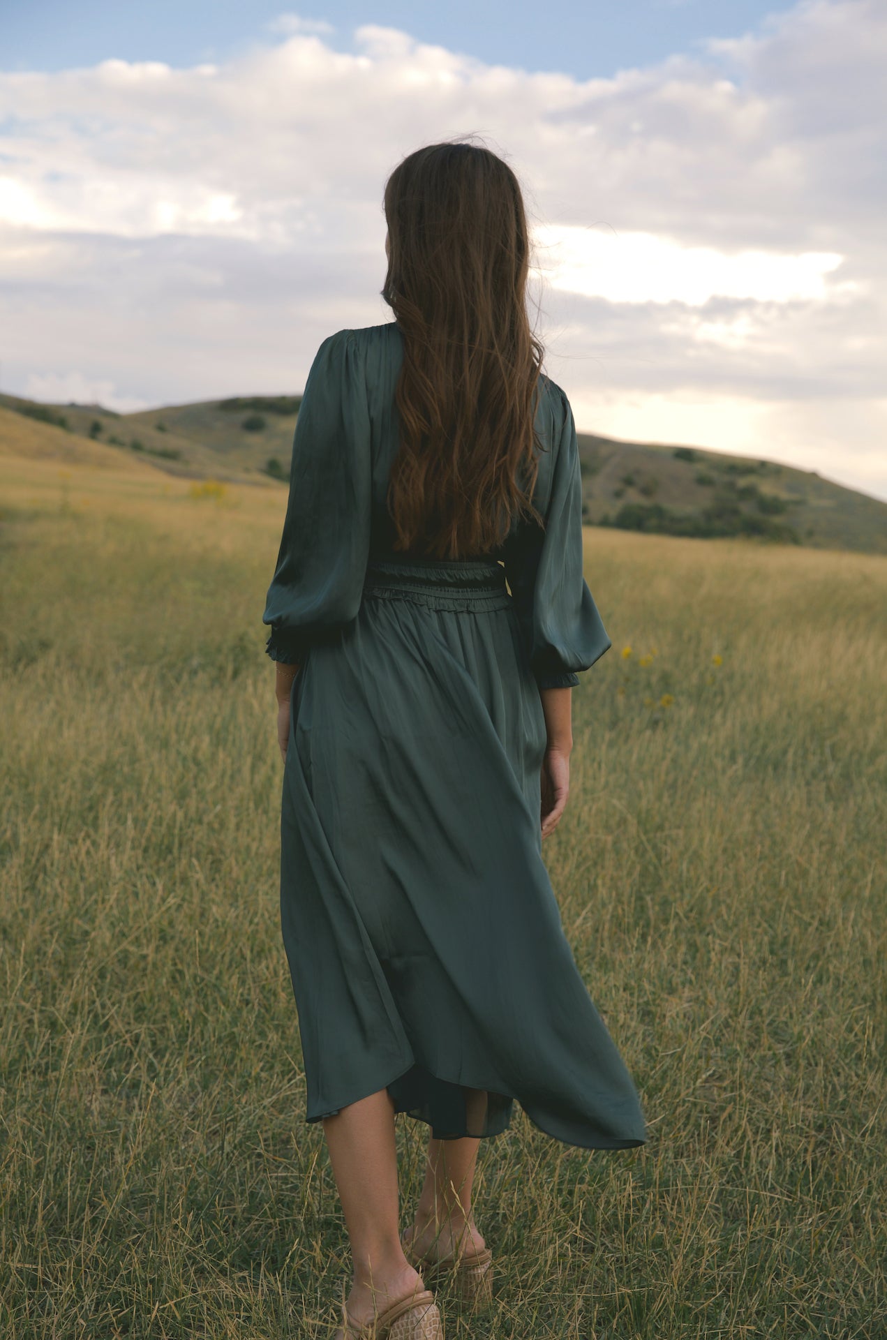 silky green surplice bodice midi dress with long sleeves