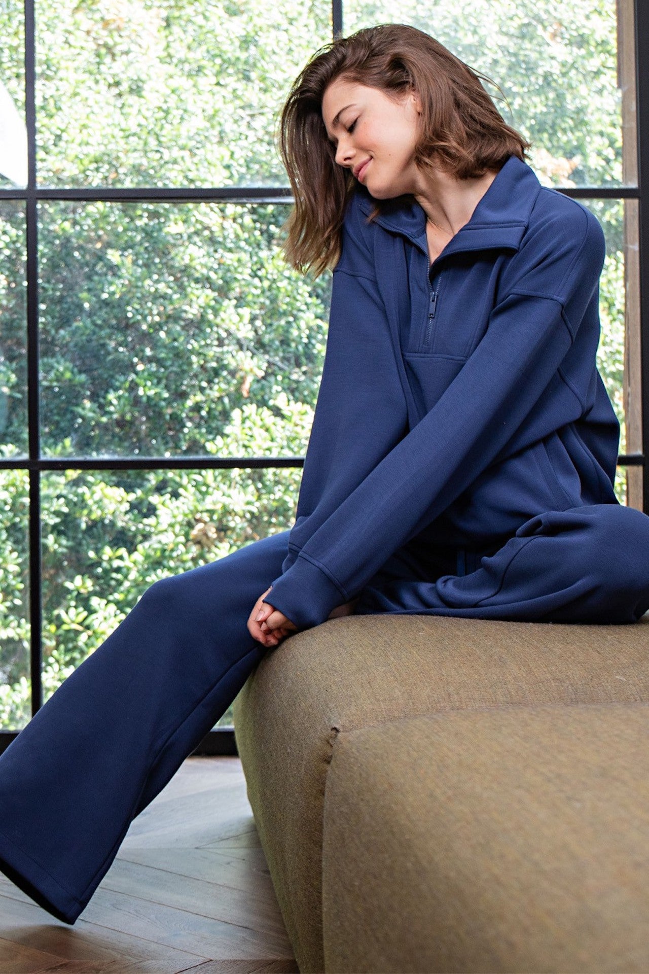 blue modal poly span sweatpants with pockets and an elastic waistband