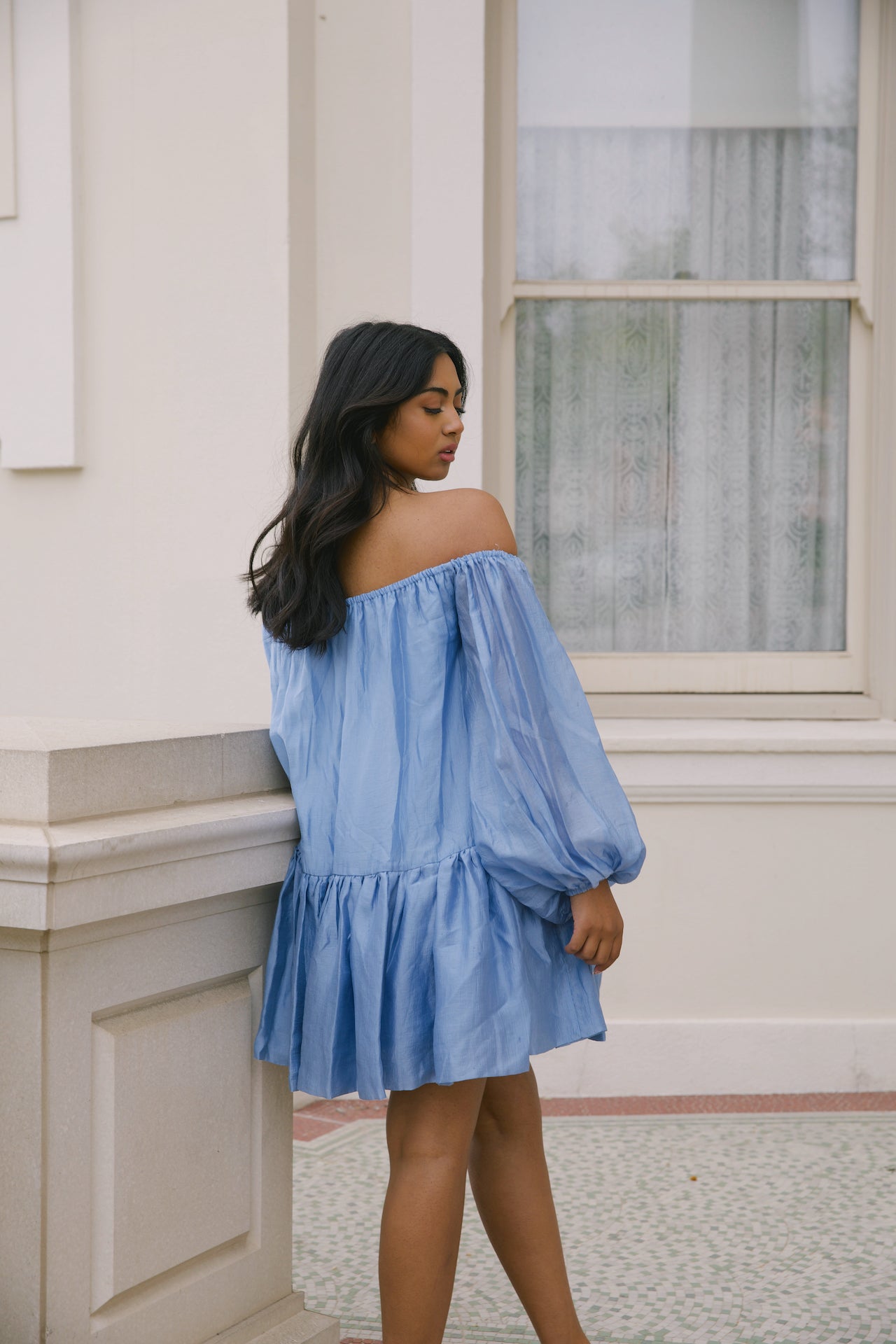 blue off the shoulder loose mini dress with puffy long sleeves and tiered skirt