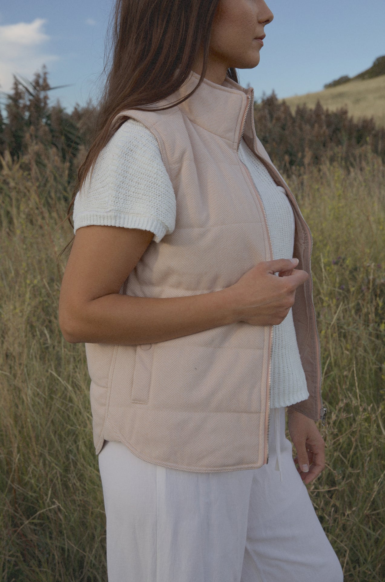 taupe padded zip up vest with a mini chevron print