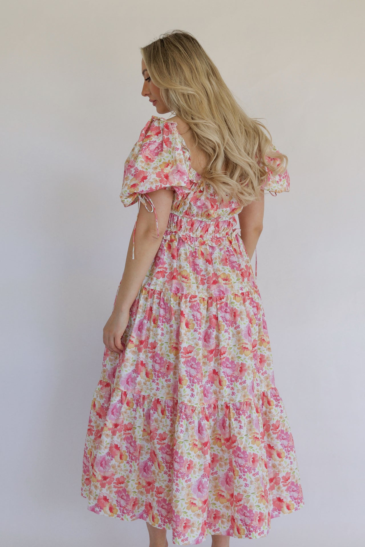 pink floral tiered maxi dress with pockets and puff sleeves