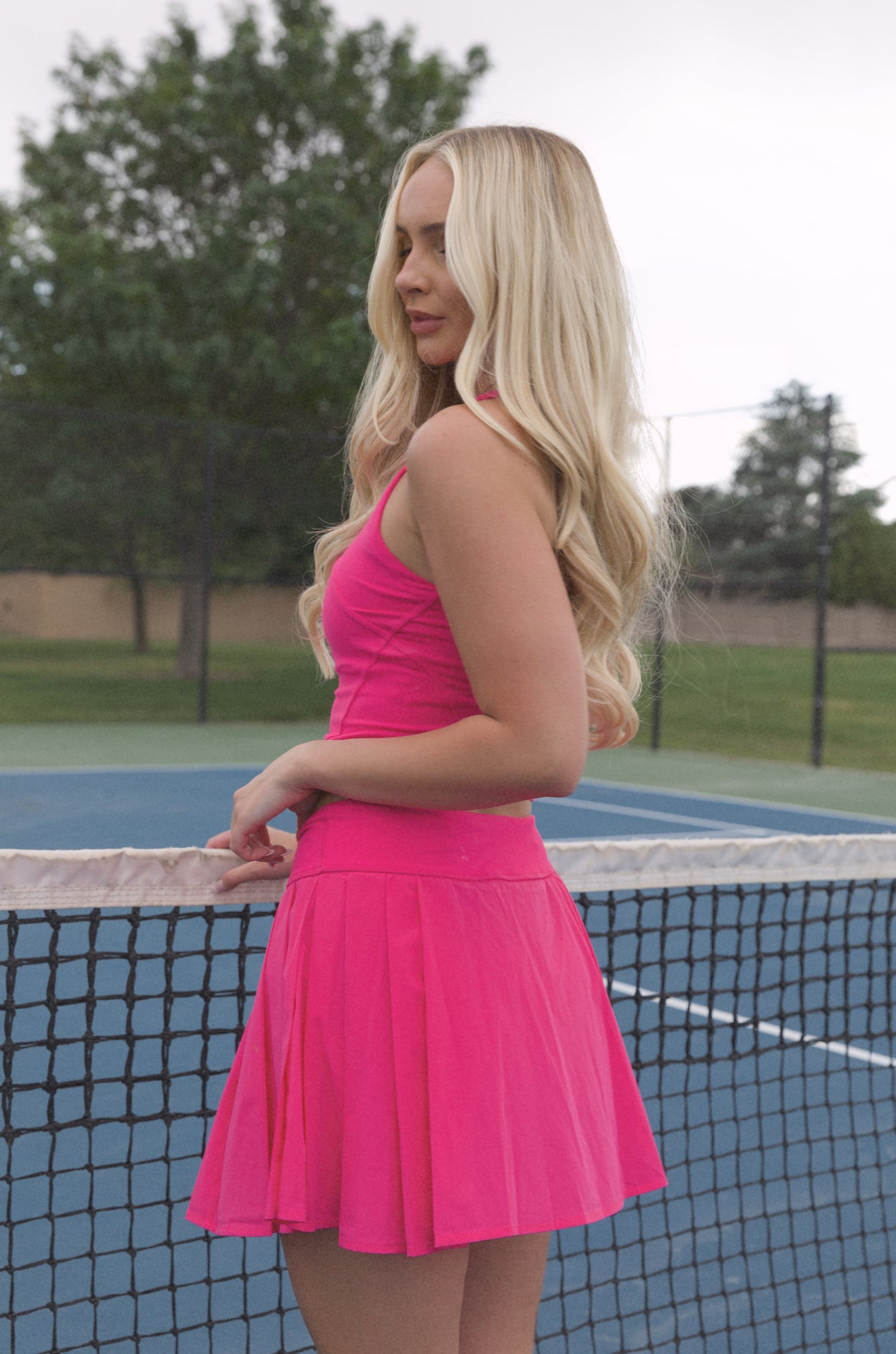 pink pleated golf mini skirt