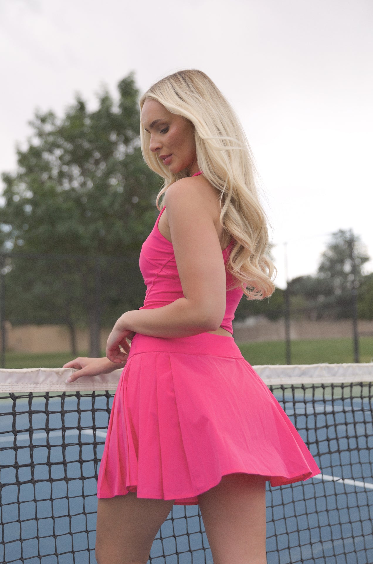 pink pleated golf mini skirt