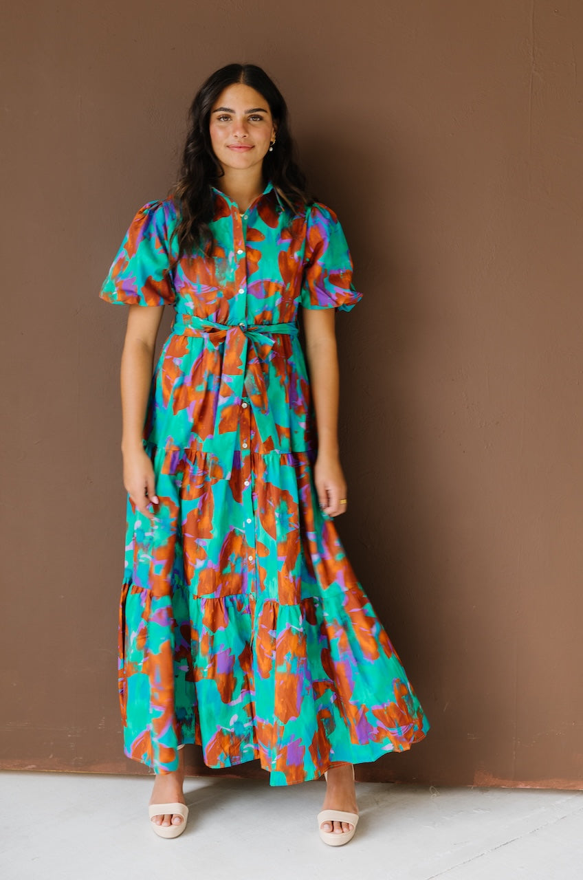 Green and brown puff sleeve button down cotton shirt dress with maxi length, waist tie and side pockets.