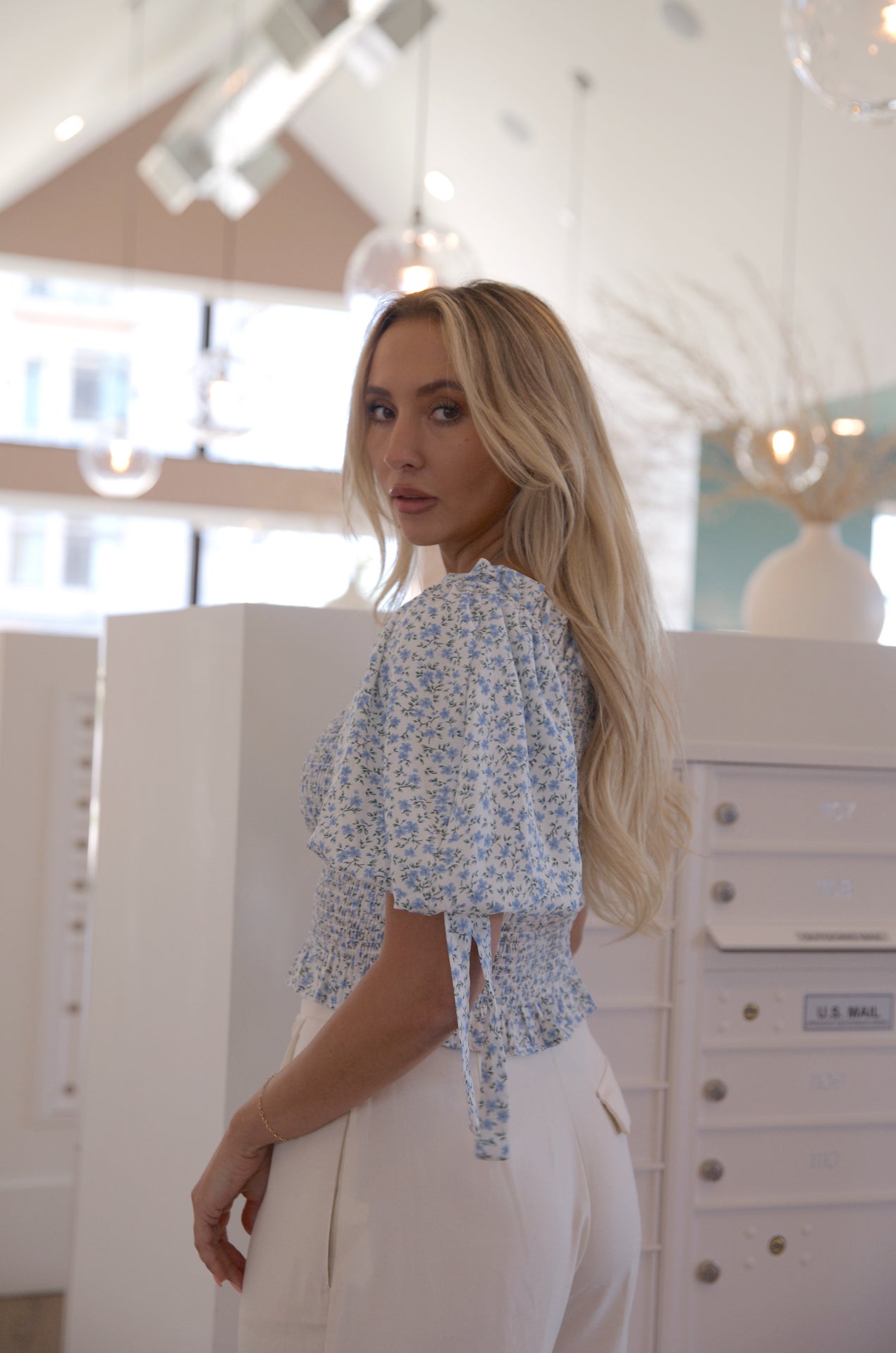 white and blue floral smocked crop top with puff sleeves