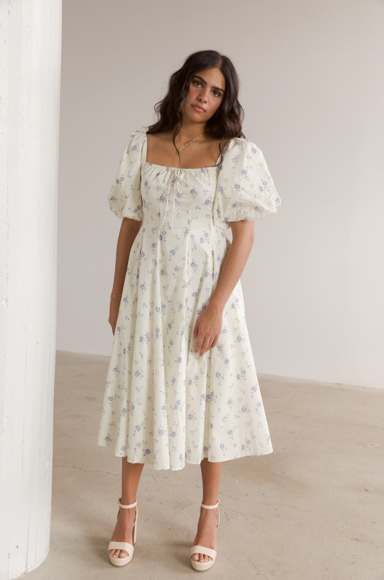 cream and blue floral midi dress with puff sleeves and square neckline