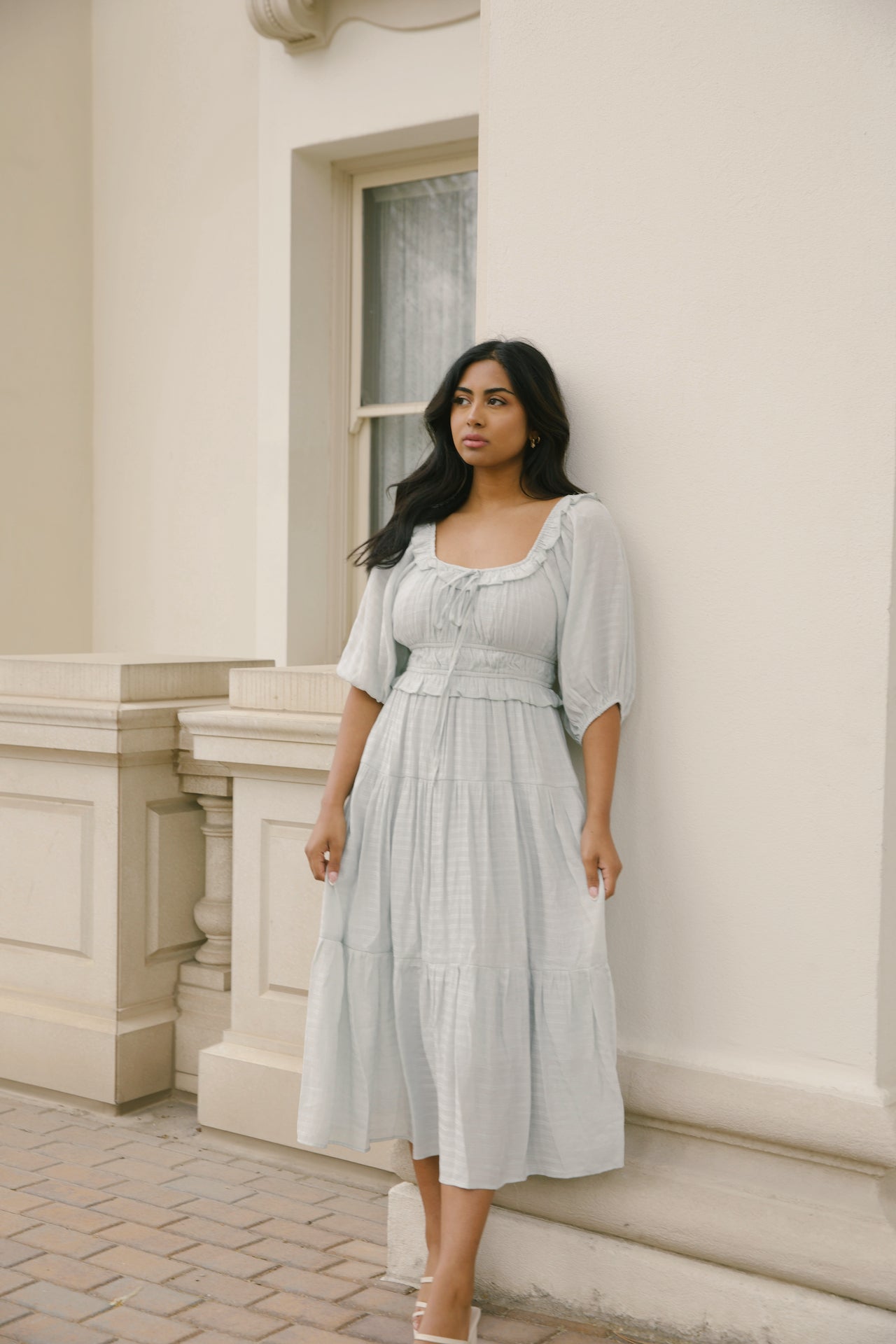 sage midi dress with puff sleeves, ruffles and a tiered midi dress style