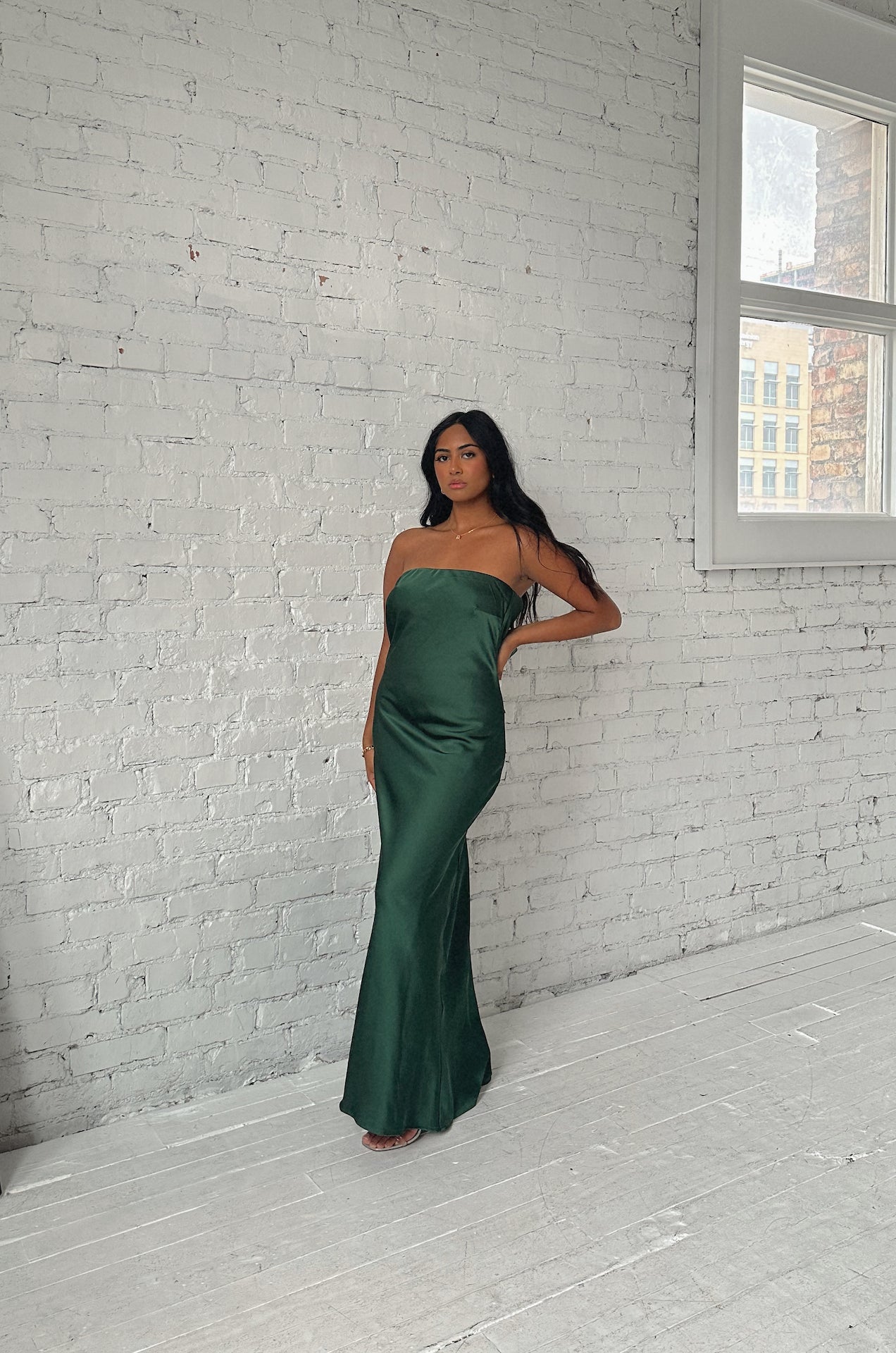 emerald green cowl back strapless maxi dress with a back bow tie