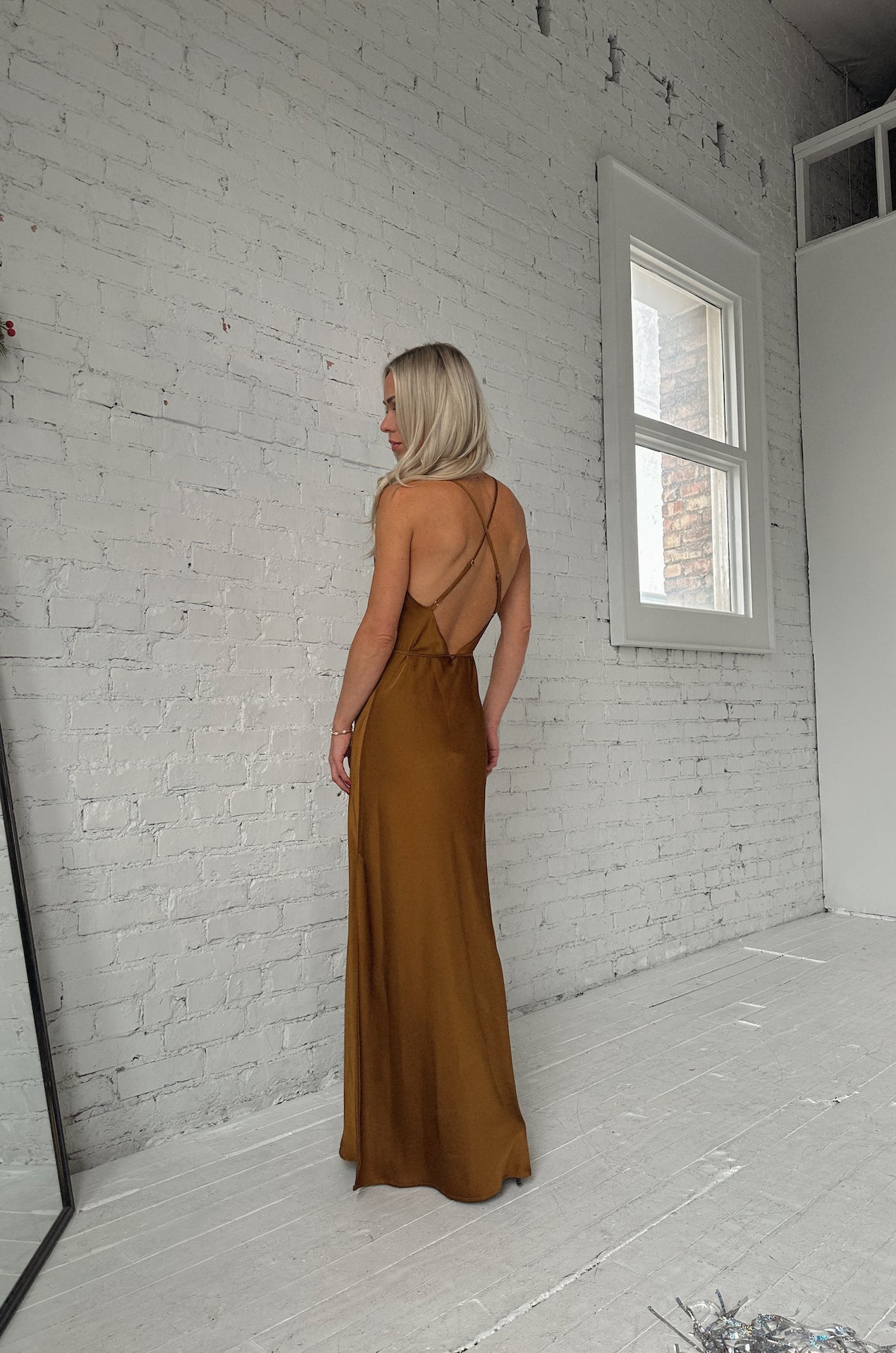 sleeveless bronze brown satin maxi dress with a cowl neckline and criss cross back