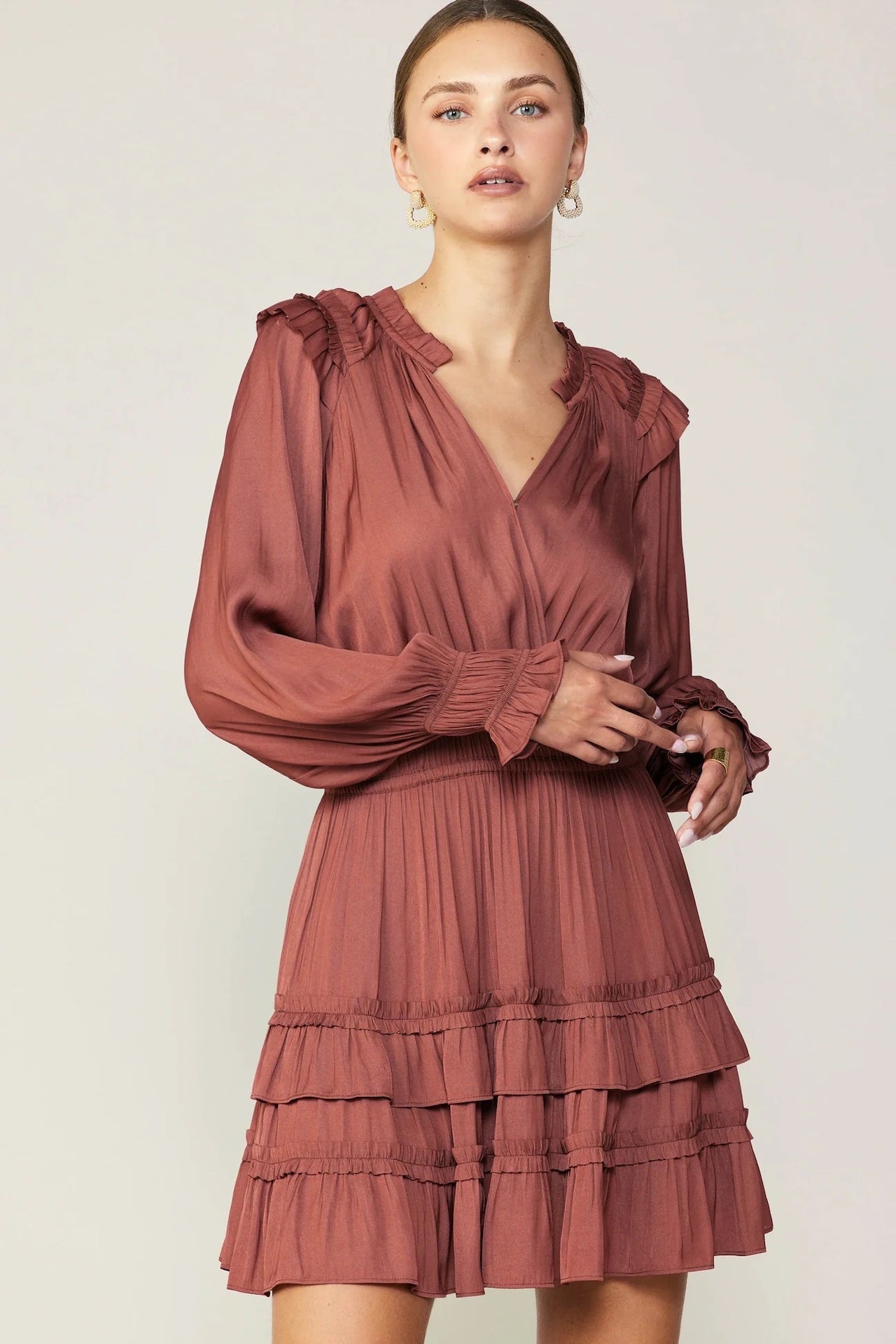 rust ruffled mini dress with long sleeves