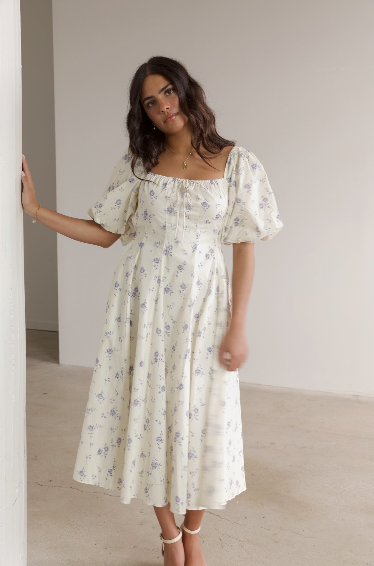 cream and blue floral midi dress with puff sleeves and square neckline