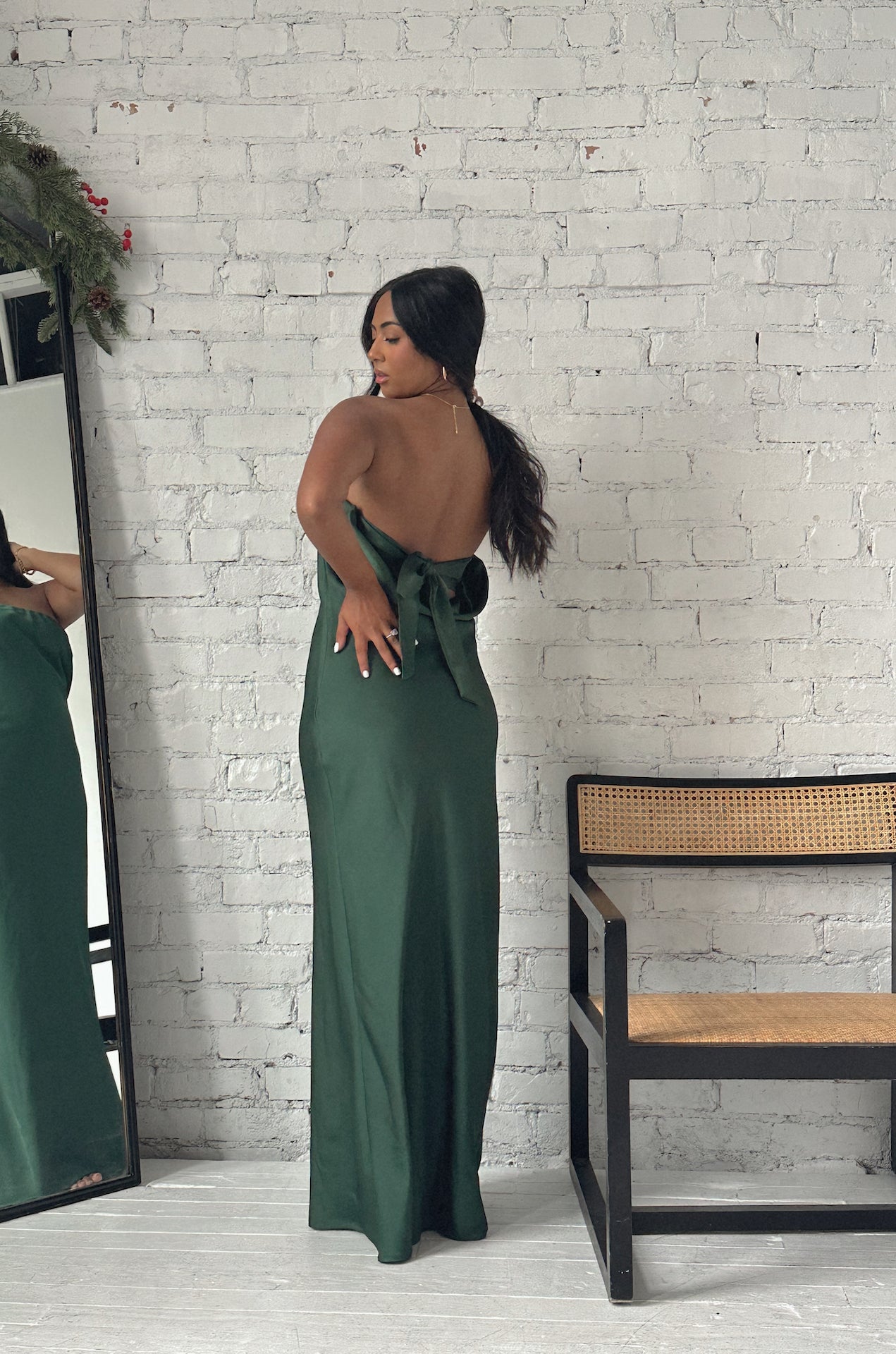 emerald green cowl back strapless maxi dress with a back bow tie
