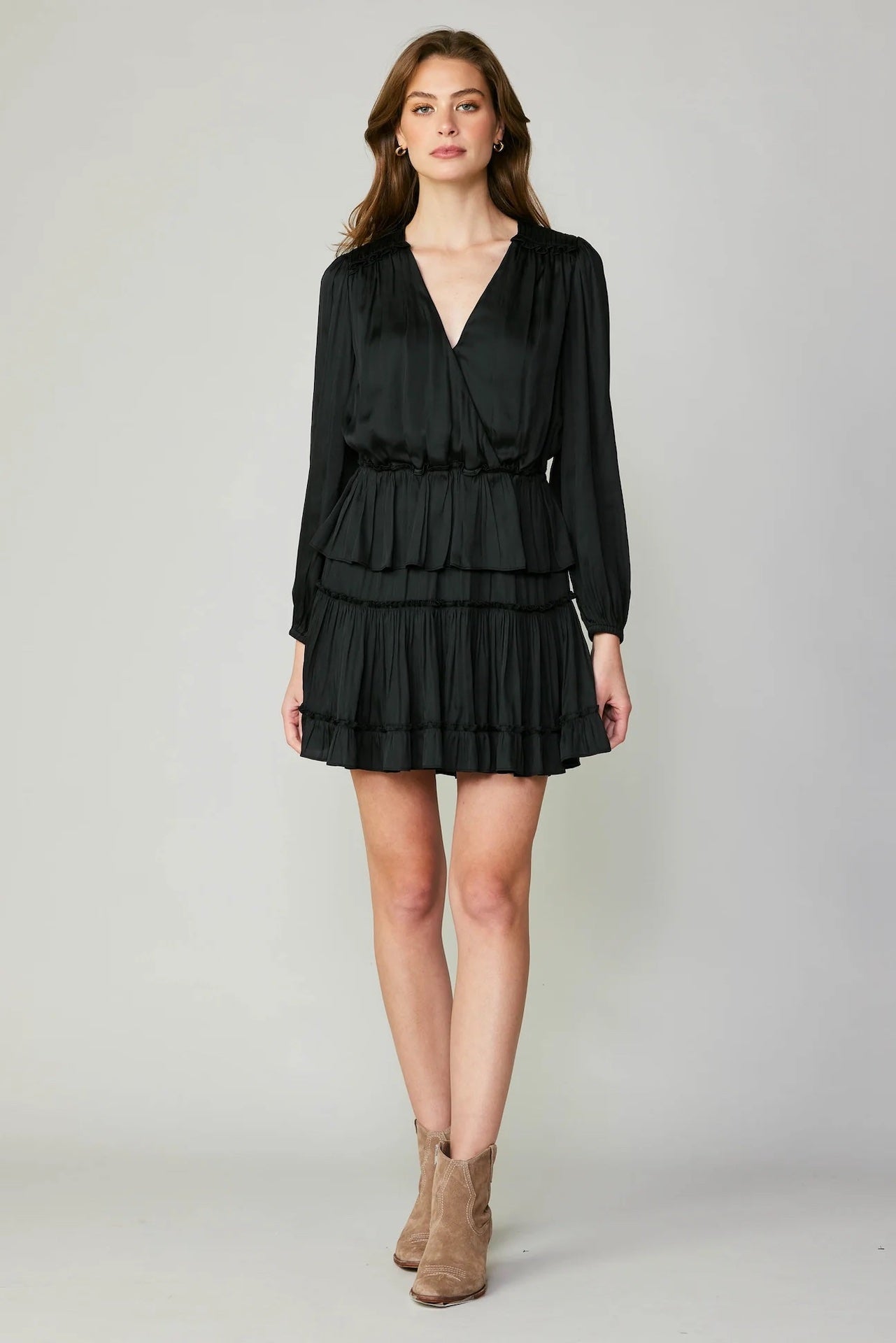 black tiered mini dress with long sleeves and pleated detail
