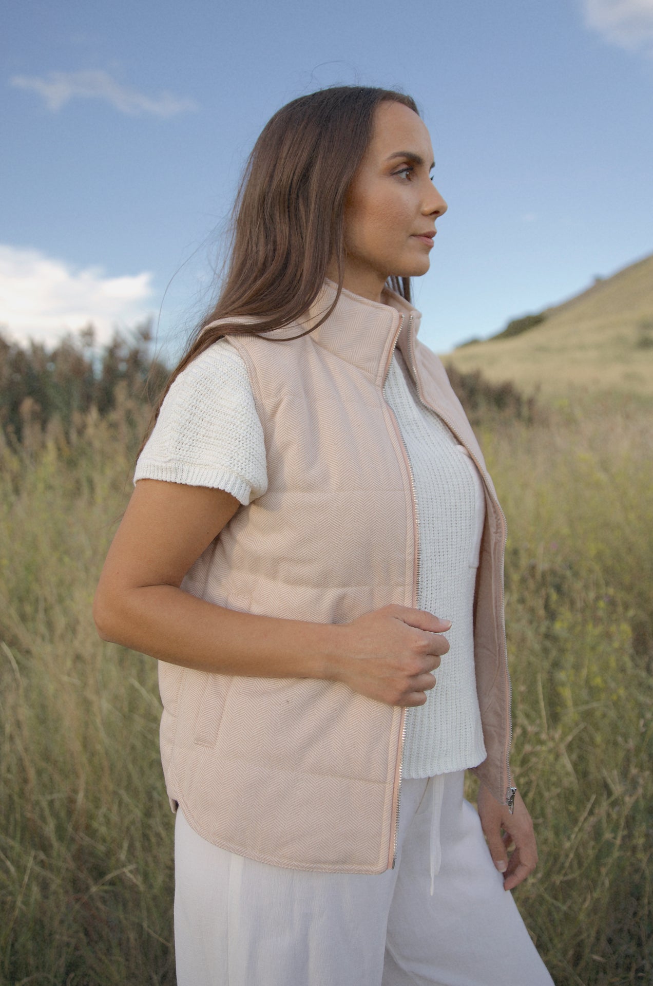 taupe padded zip up vest with a mini chevron print