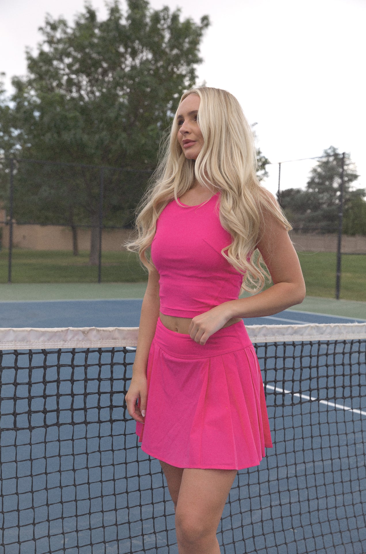 pink pleated golf mini skirt