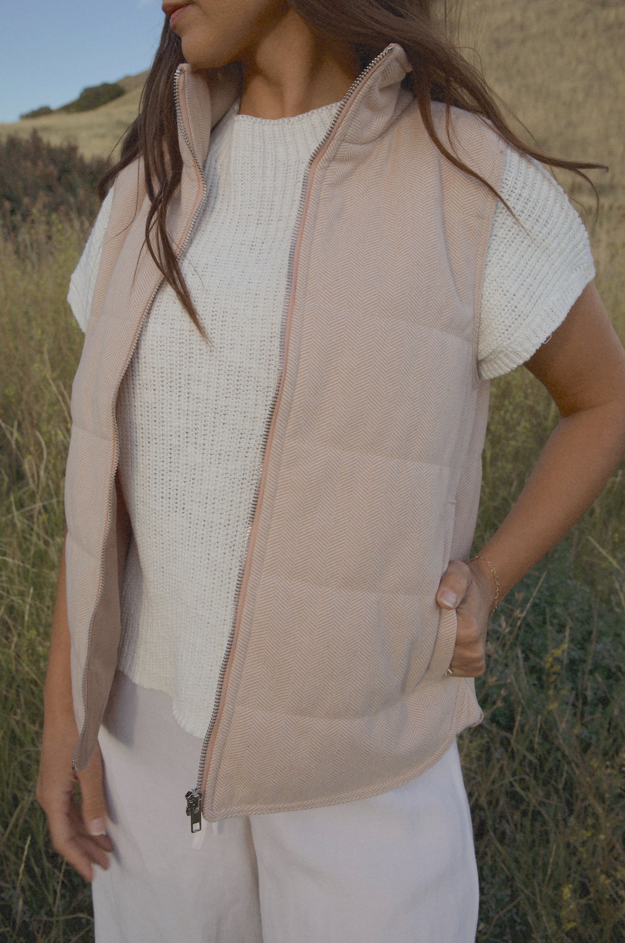 taupe padded zip up vest with a mini chevron print