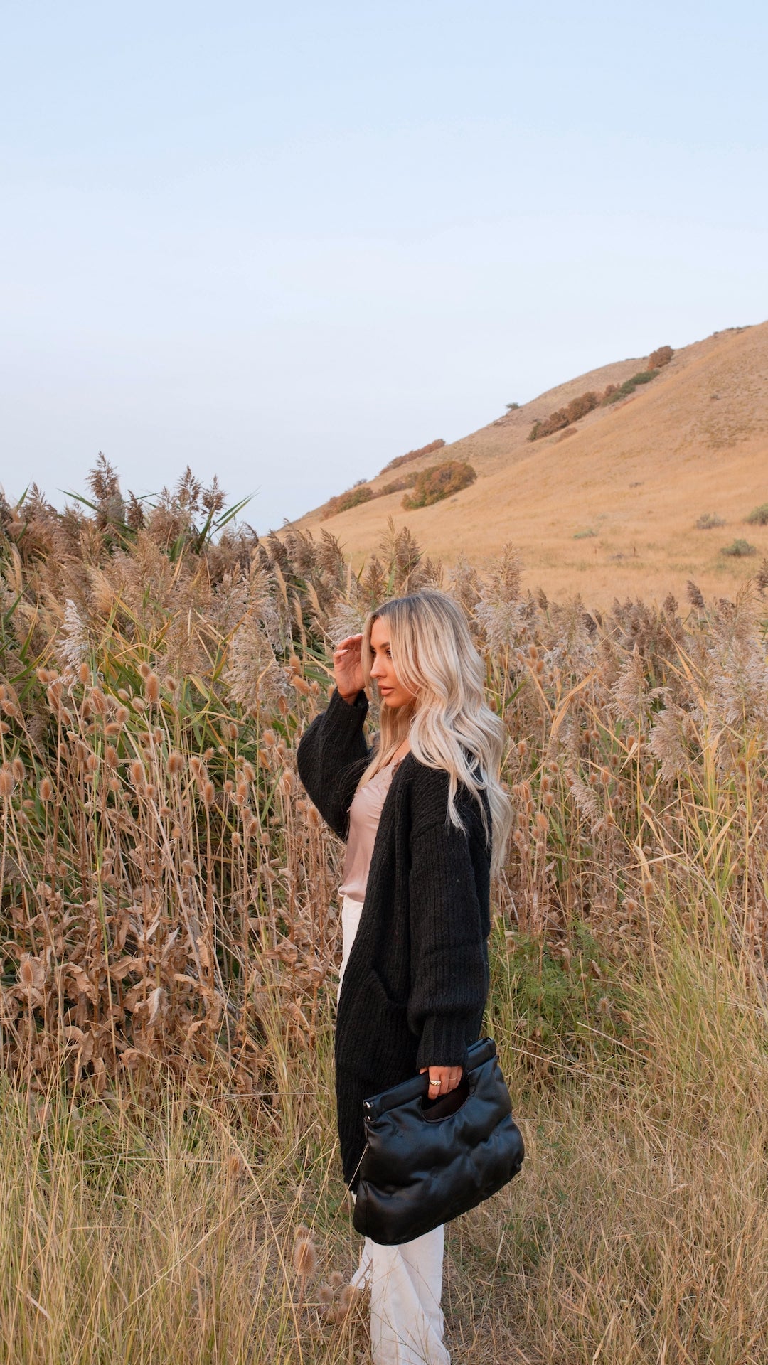 black chunky knit cardigan with pockets and balloon sleeves