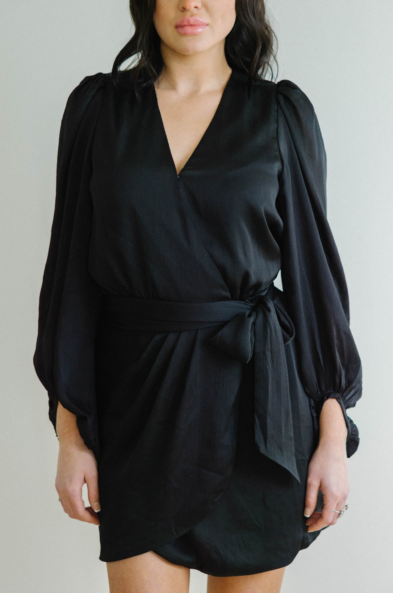 black wrap mini dress with long sleeves