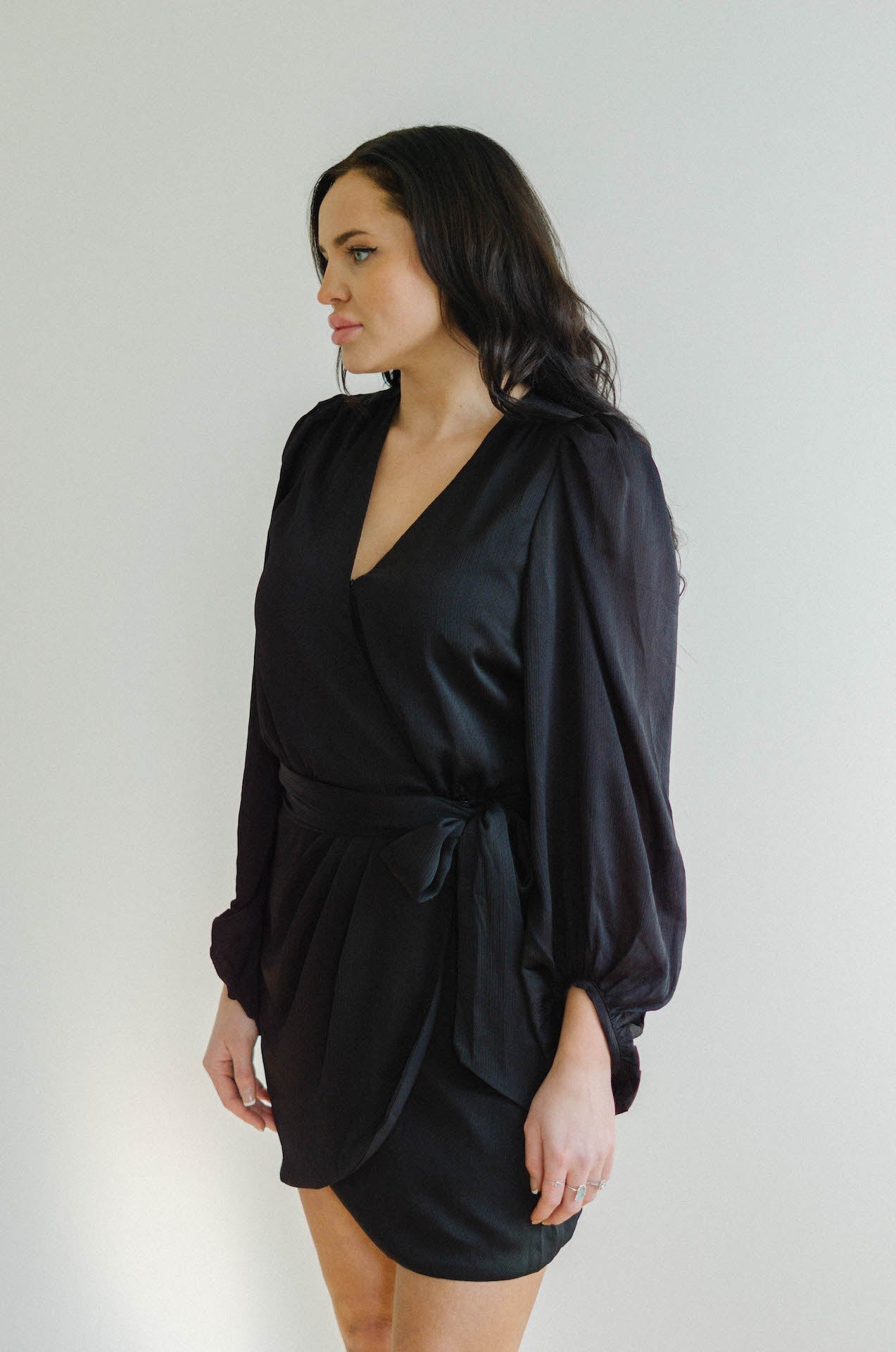 black wrap mini dress with long sleeves