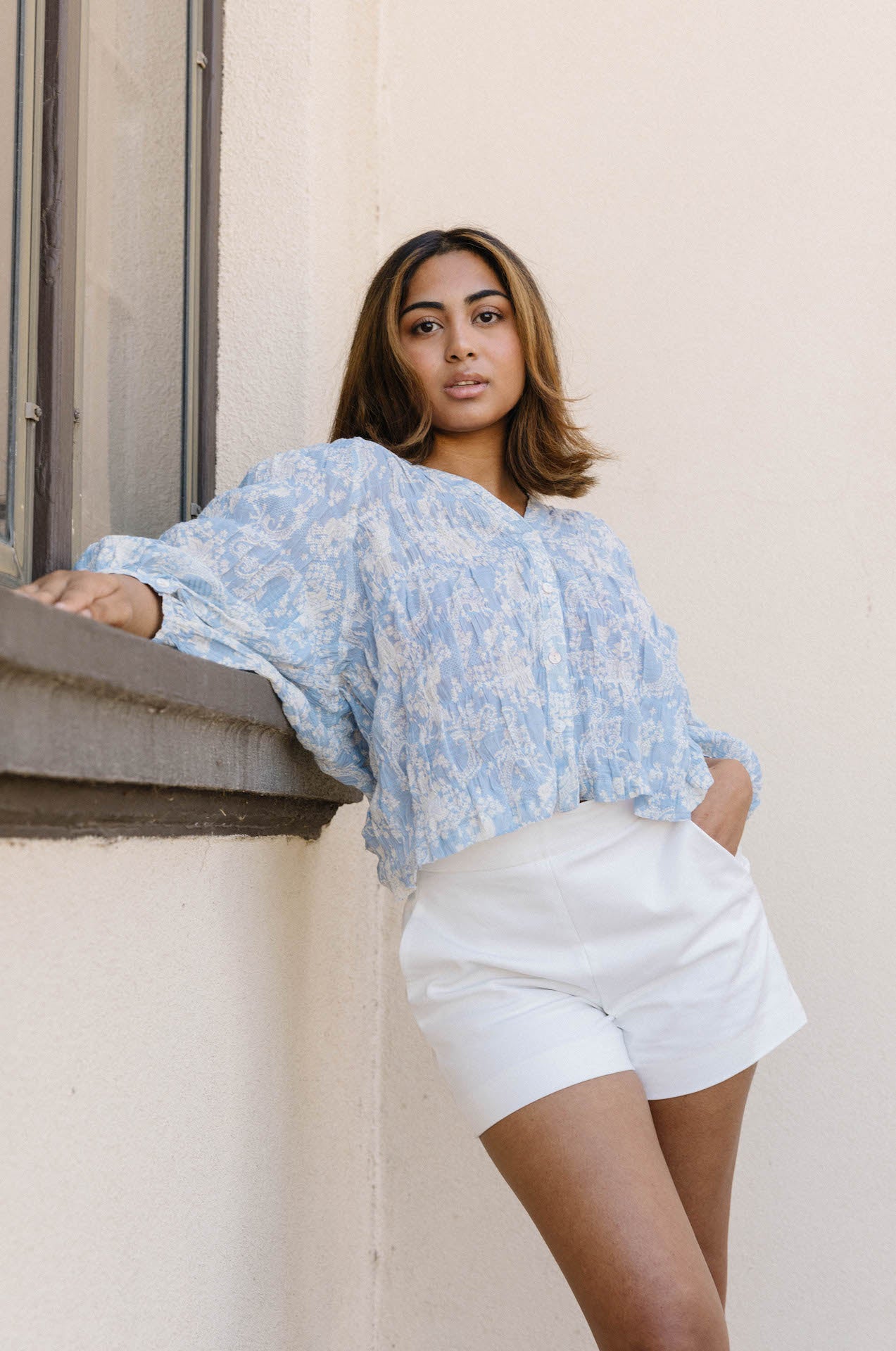 blue and white floral top with sleeves