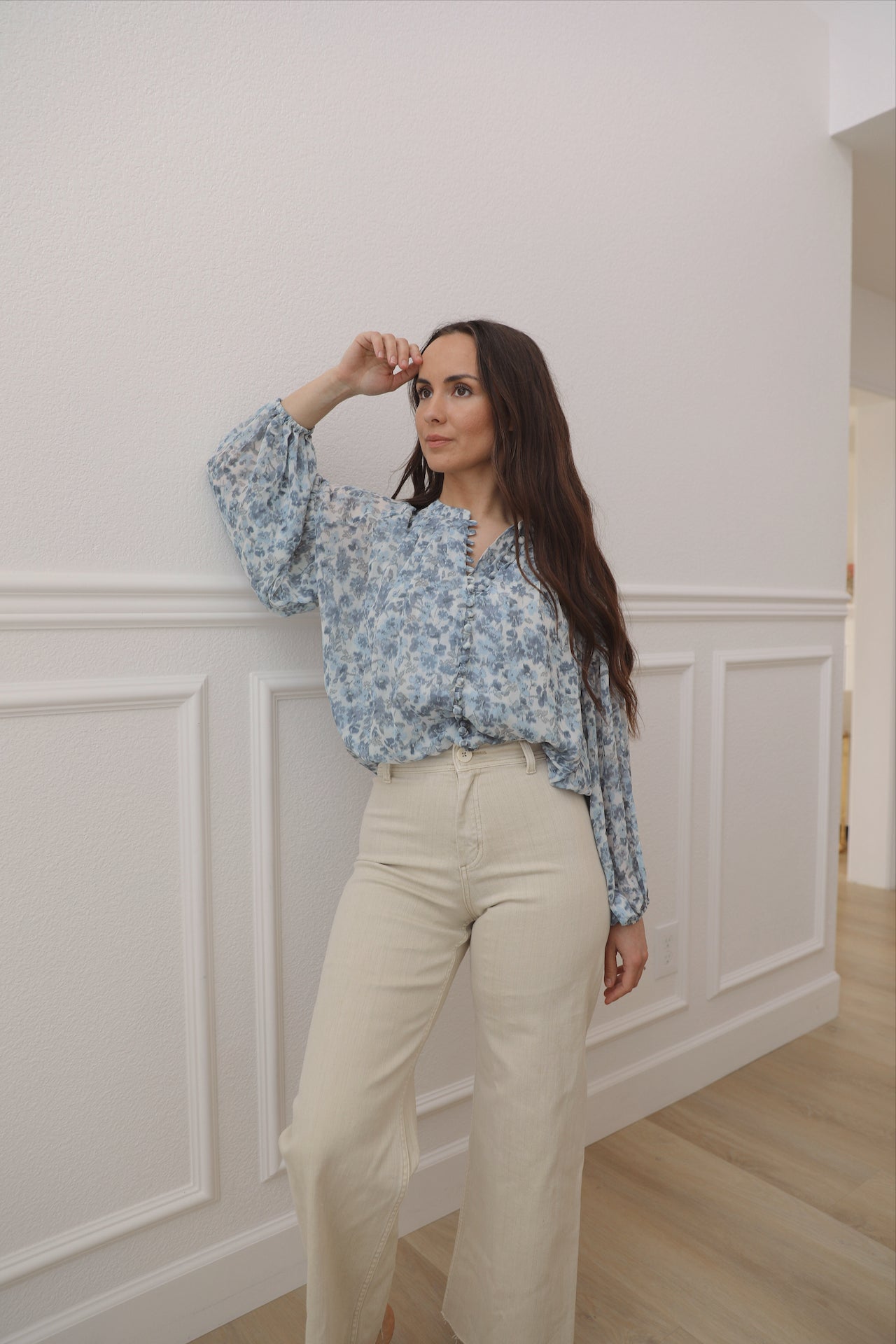 blue floral top with long sleeves and front fabric buttons